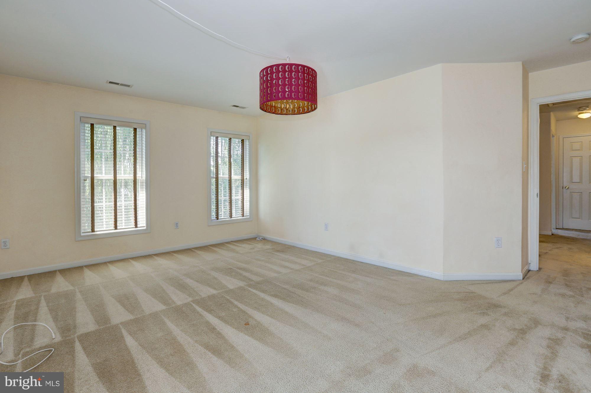 1407 Jasper Street Silver Spring, MD 20902 - Photo 8 of 21 an empty room with windows