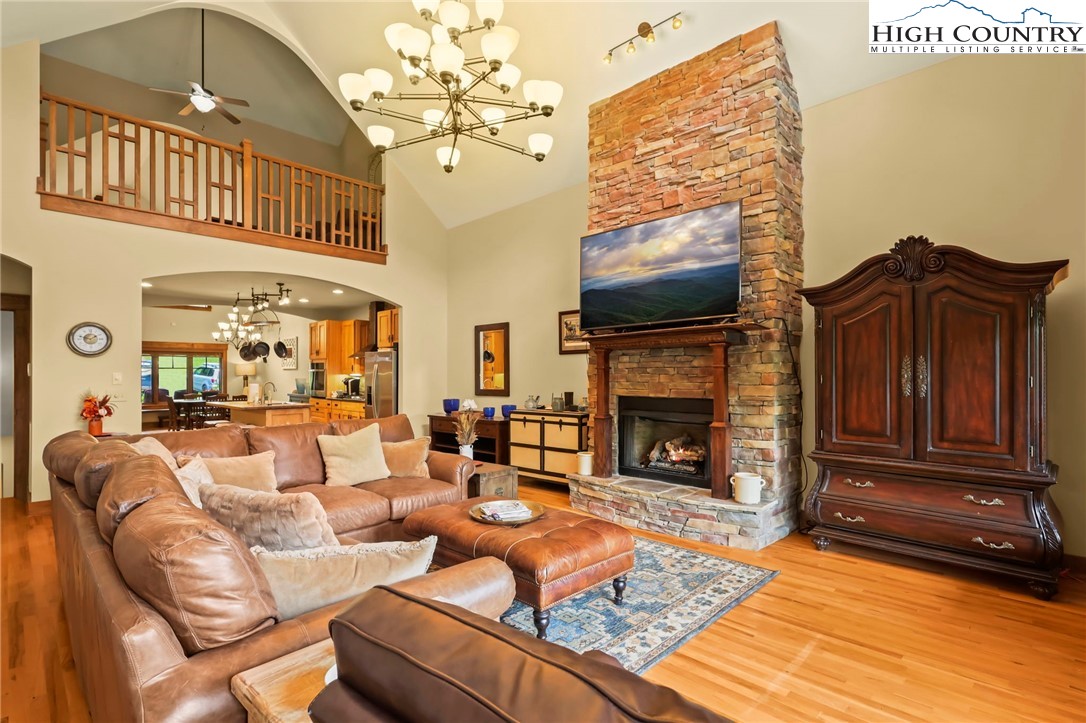 138 South Camp Road, Unit 103 Boone, NC 28607 - Photo 20 of 50 a living room with furniture a flat screen tv and a fireplace