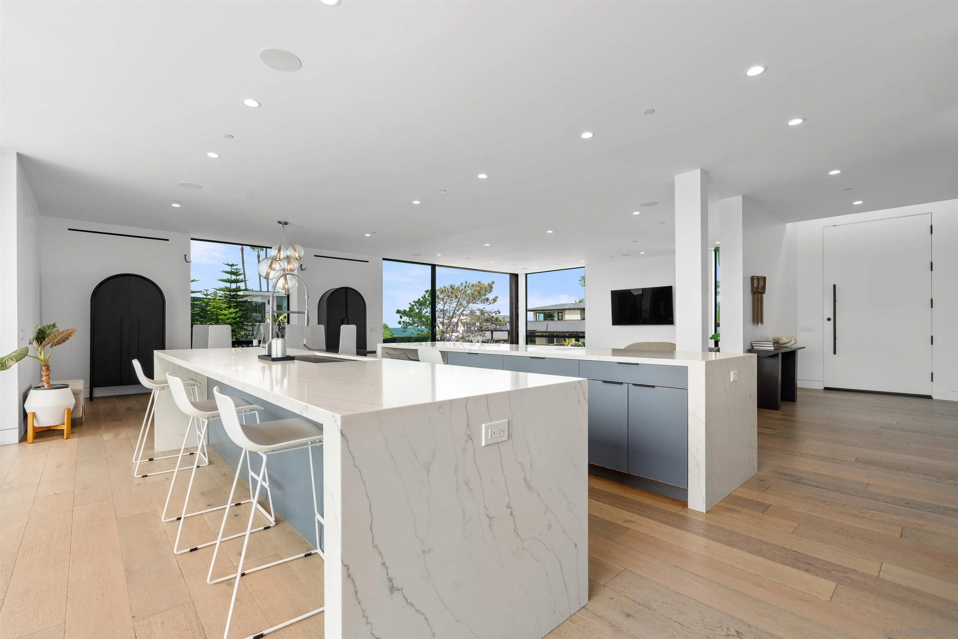 223 Ocean Street Solana Beach, CA 92075 - Photo 13 of 47 a open kitchen with stainless steel appliances kitchen island a stove a sink a refrigerator and chairs