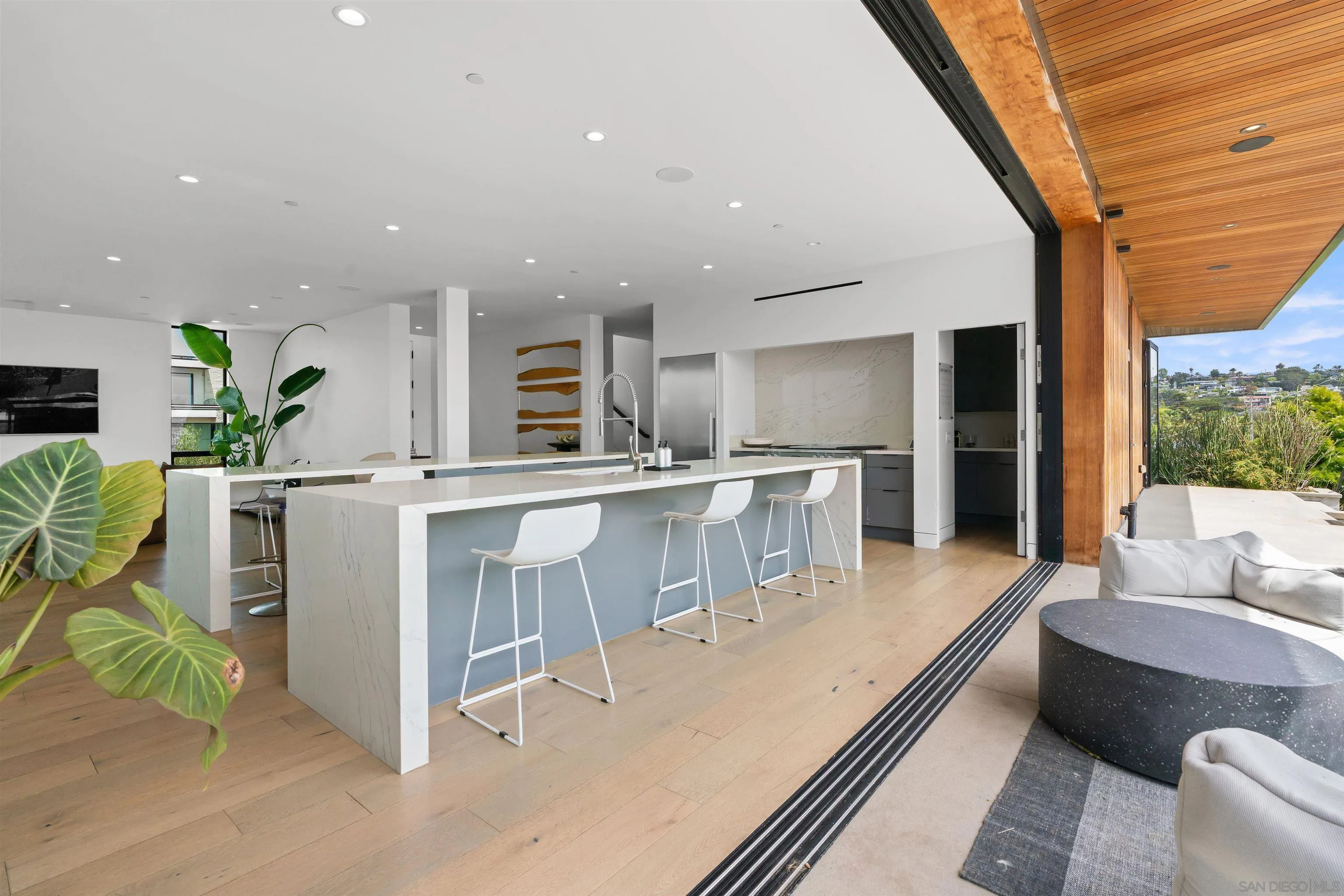 223 Ocean Street Solana Beach, CA 92075 - Photo 16 of 47 a large kitchen with kitchen island a large window in it