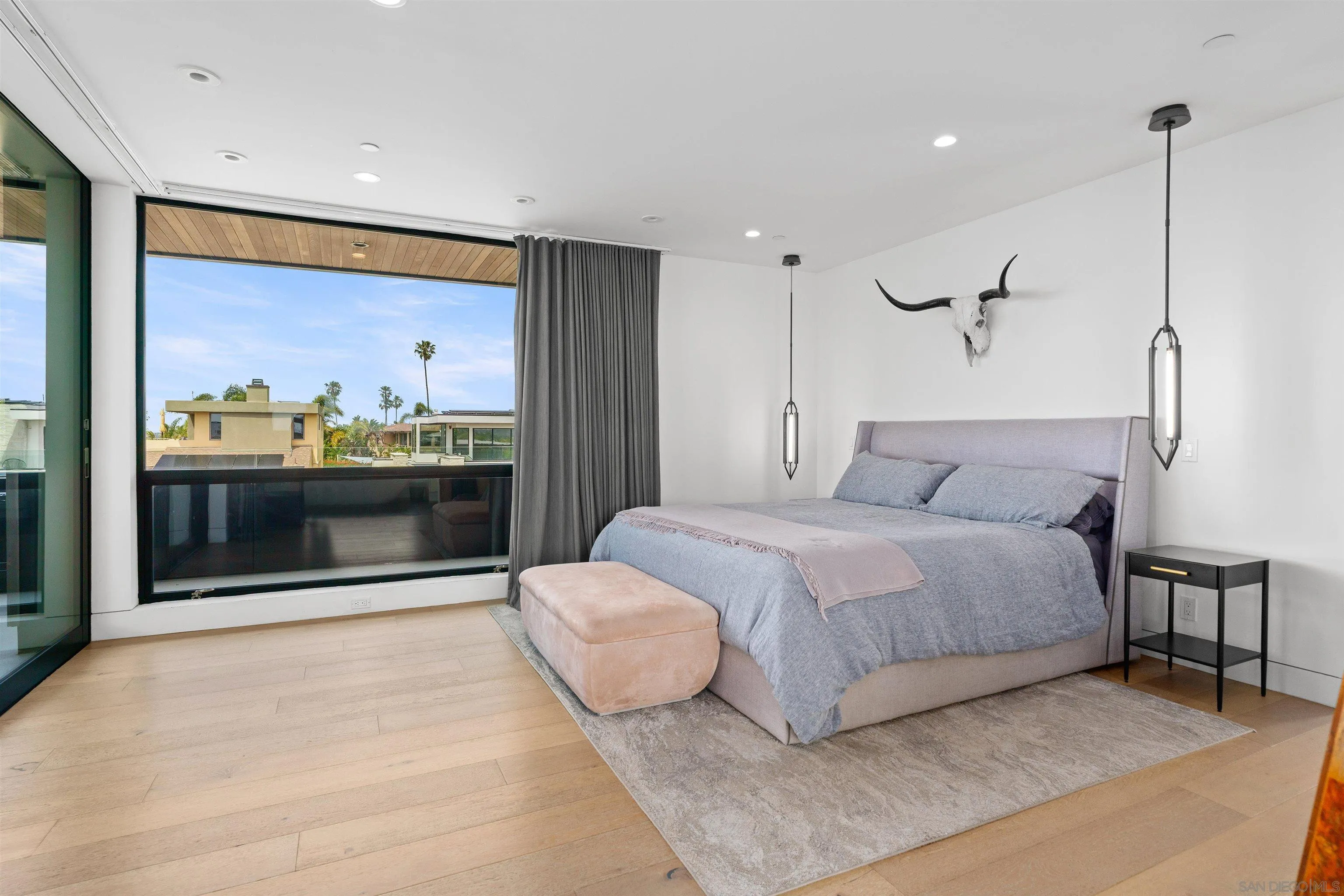 223 Ocean Street Solana Beach, CA 92075 - Photo 21 of 47 a spacious bedroom with a bed and glass wall