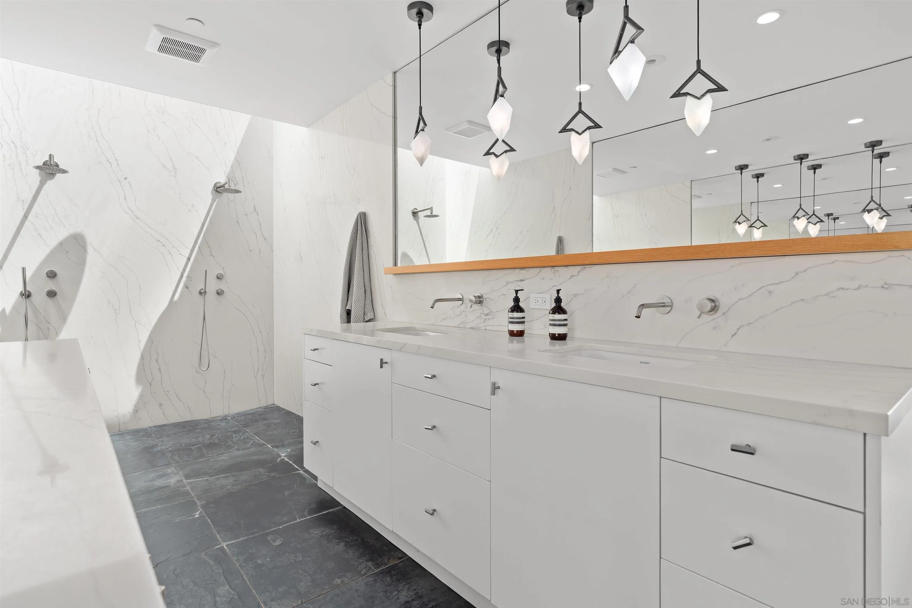 223 Ocean Street Solana Beach, CA 92075 - Photo 26 of 47 a bathroom with a sink vanity and mirror