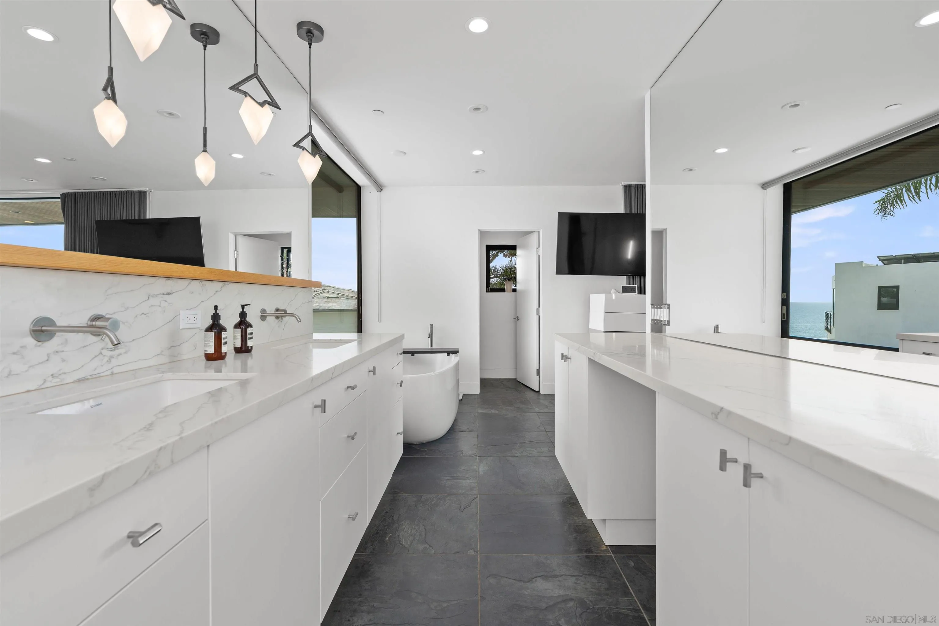 223 Ocean Street Solana Beach, CA 92075 - Photo 27 of 47 a large white kitchen with a large window a sink and a large window