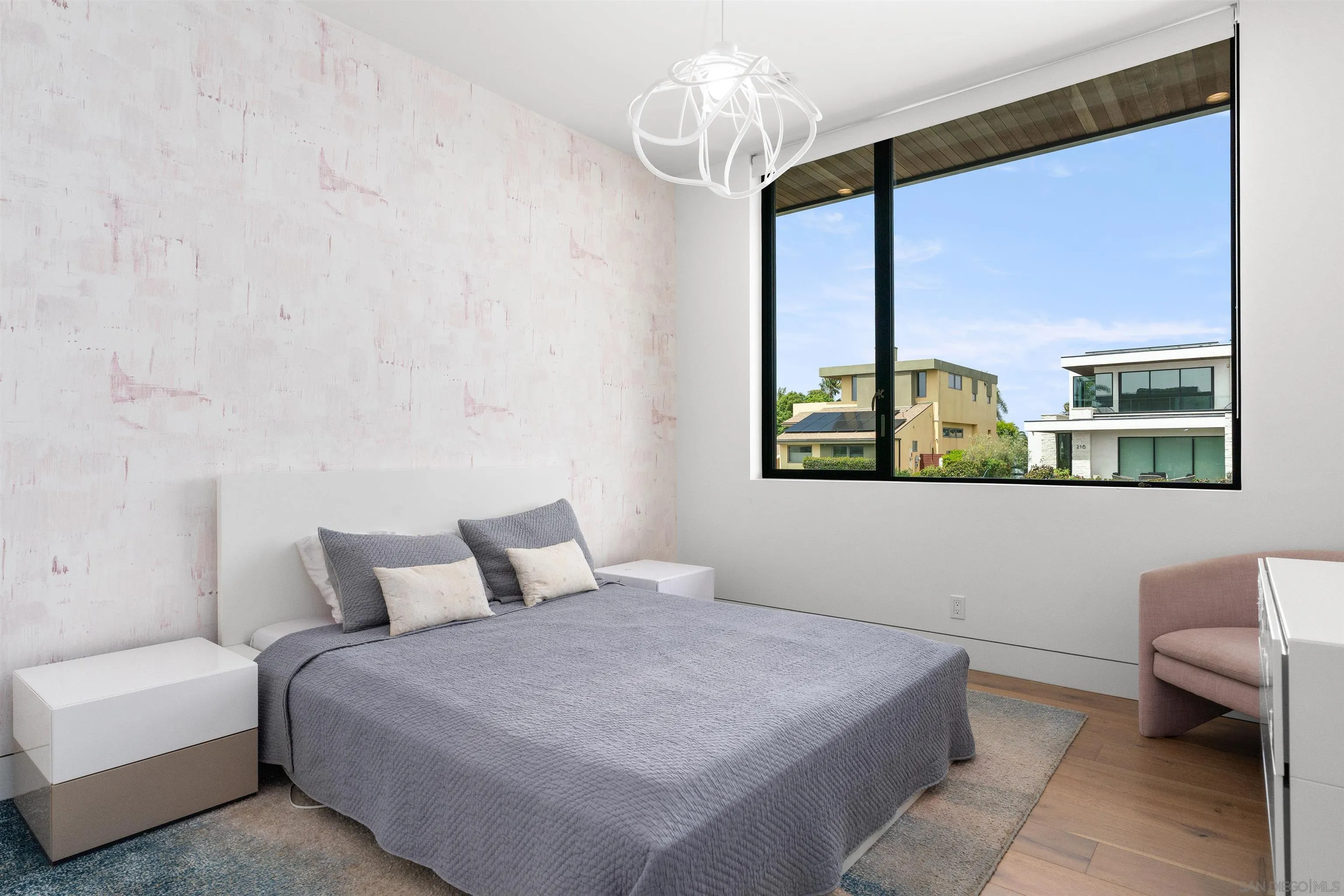 223 Ocean Street Solana Beach, CA 92075 - Photo 28 of 47 a bedroom with a large bed and a window