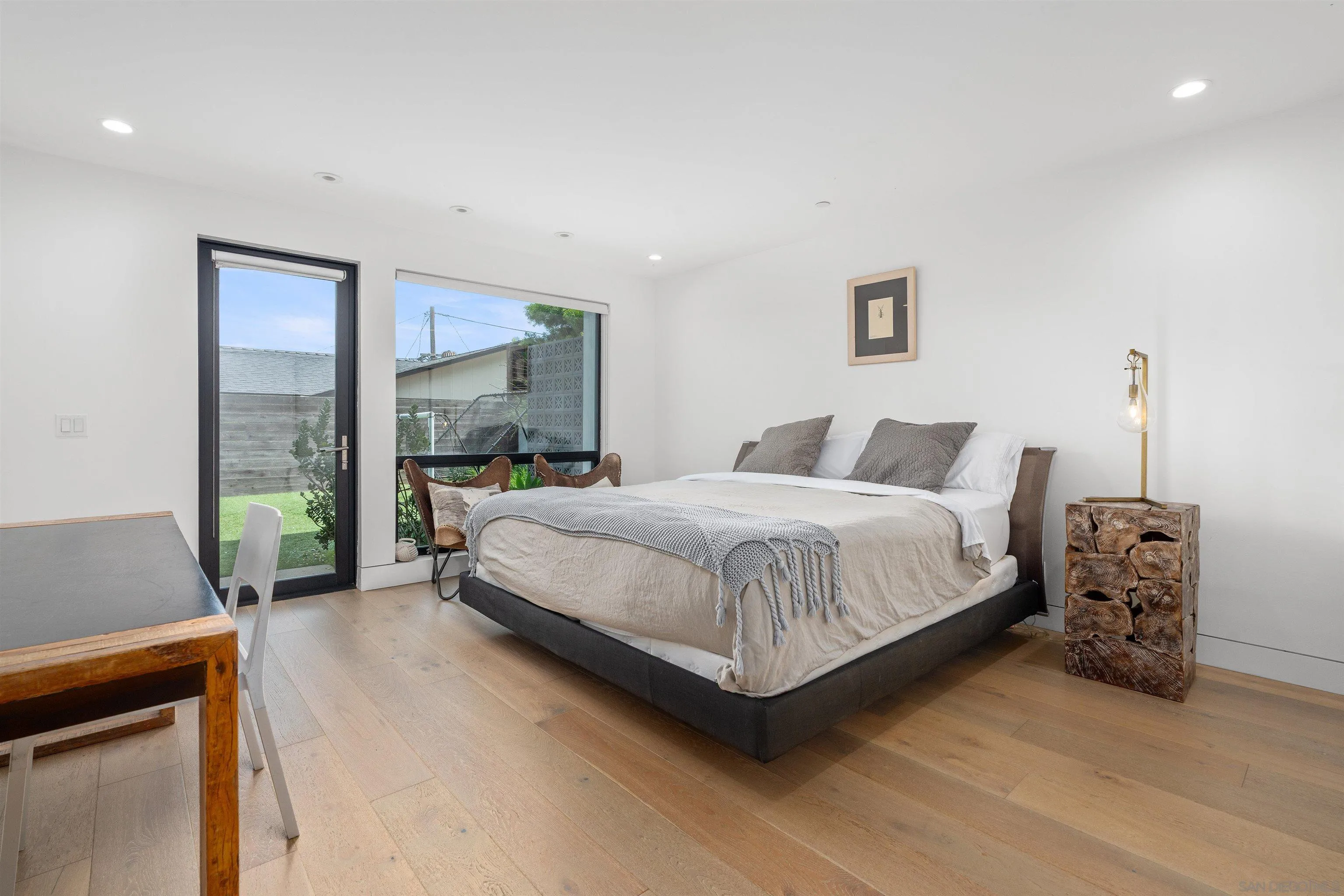 223 Ocean Street Solana Beach, CA 92075 - Photo 32 of 47 a bedroom with a bed and a couch