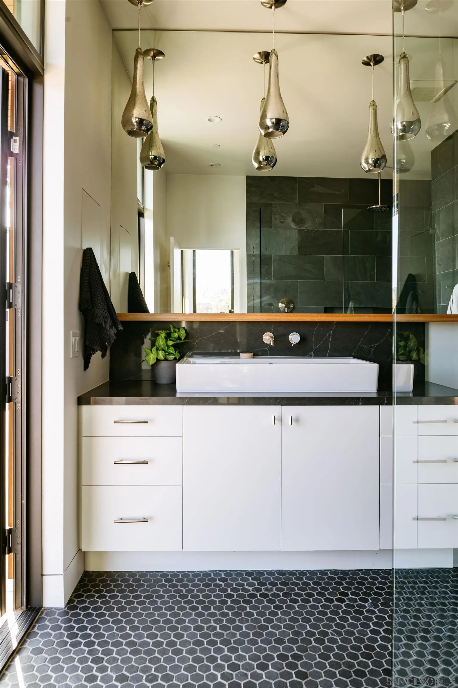 223 Ocean Street Solana Beach, CA 92075 - Photo 34 of 47 a bathroom with a sink and a mirror