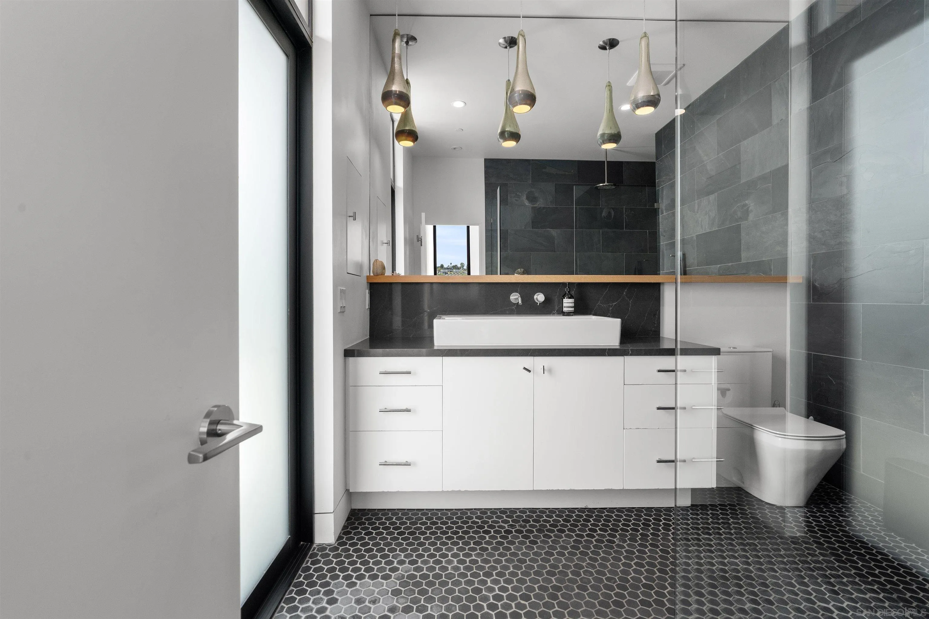 223 Ocean Street Solana Beach, CA 92075 - Photo 37 of 47 a bathroom with a sink toilet and shower