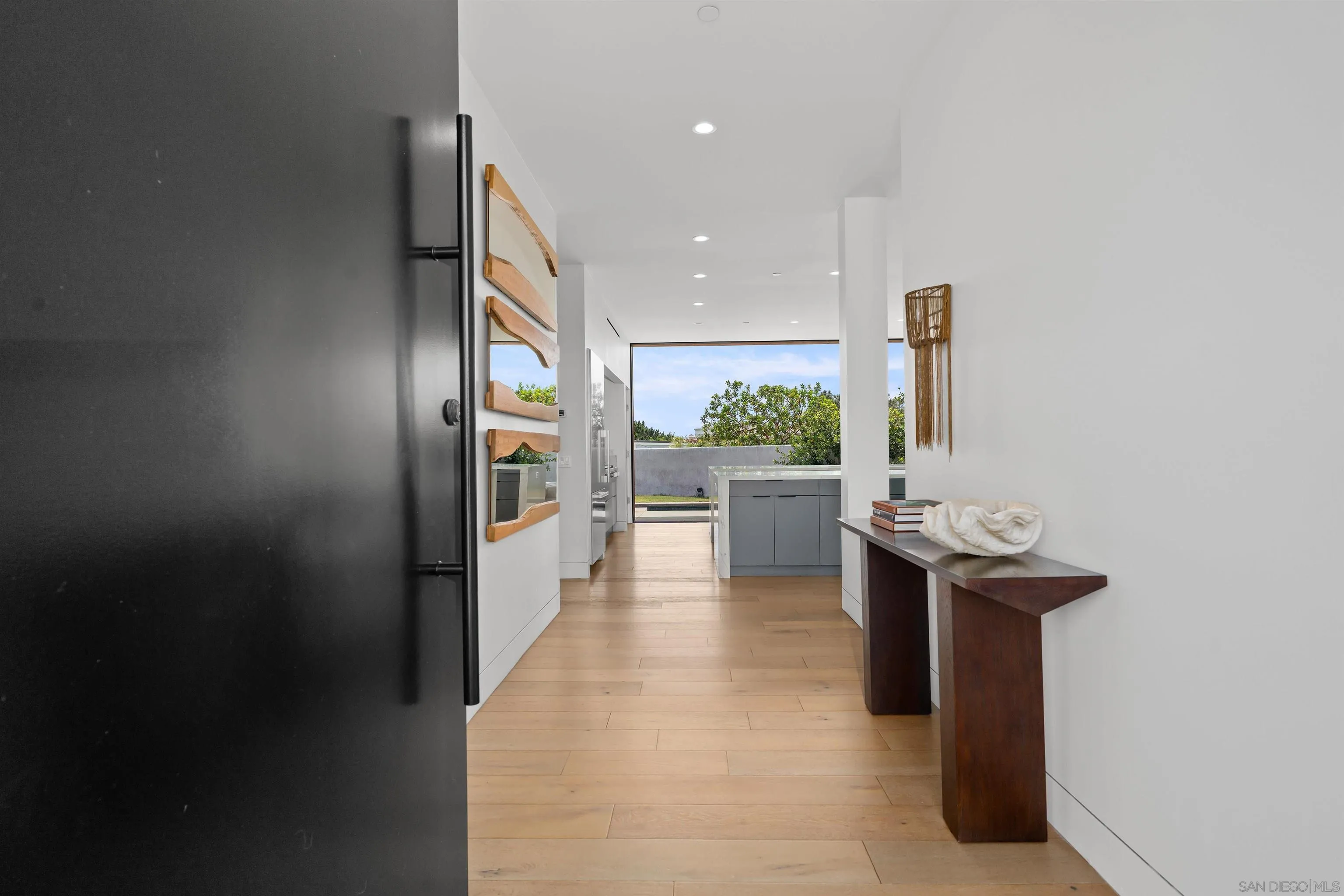 223 Ocean Street Solana Beach, CA 92075 - Photo 5 of 47 a kitchen with stainless steel appliances granite countertop a refrigerator and a stove