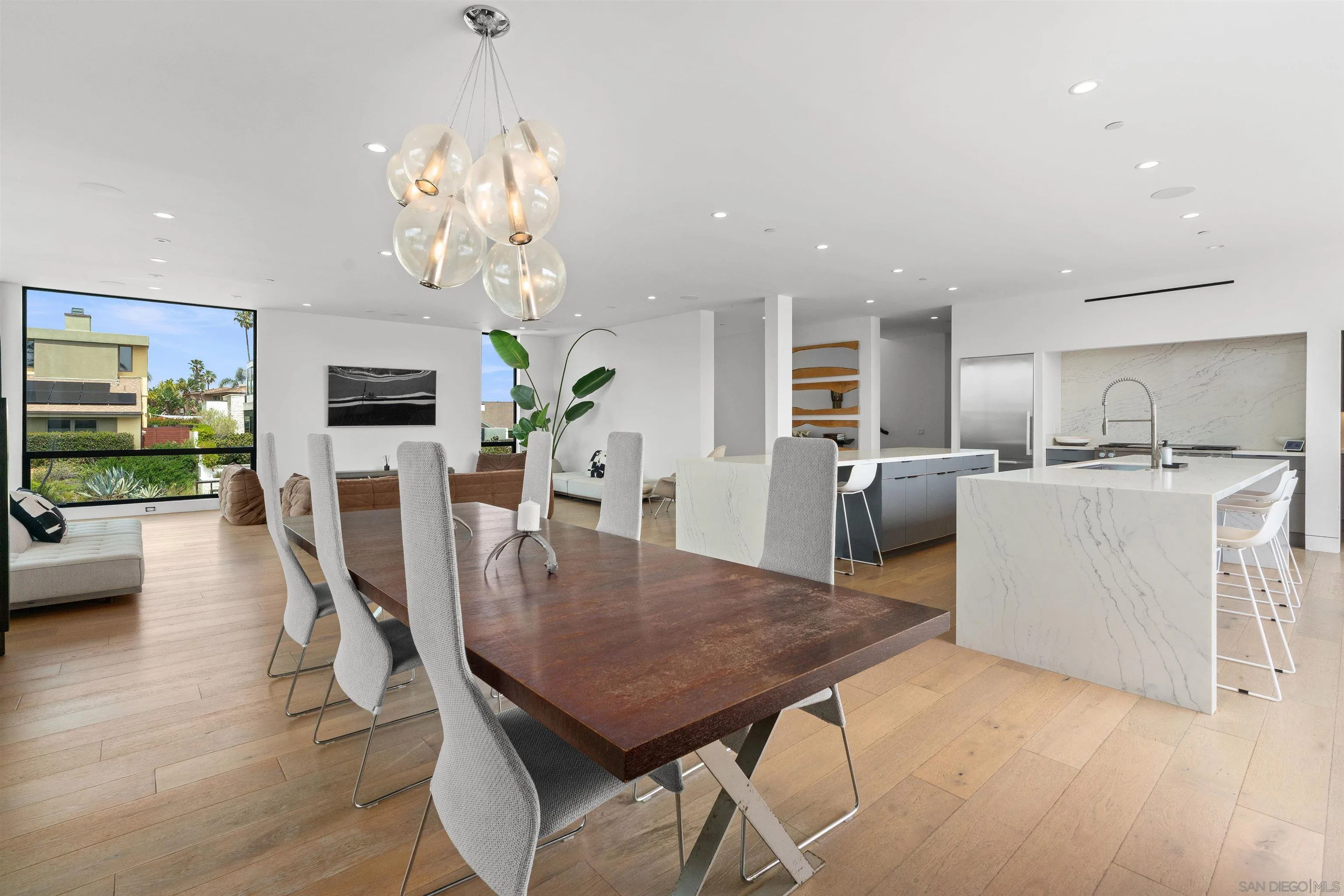 223 Ocean Street Solana Beach, CA 92075 - Photo 6 of 47 a view of a dining room with furniture a chandelier and wooden floor