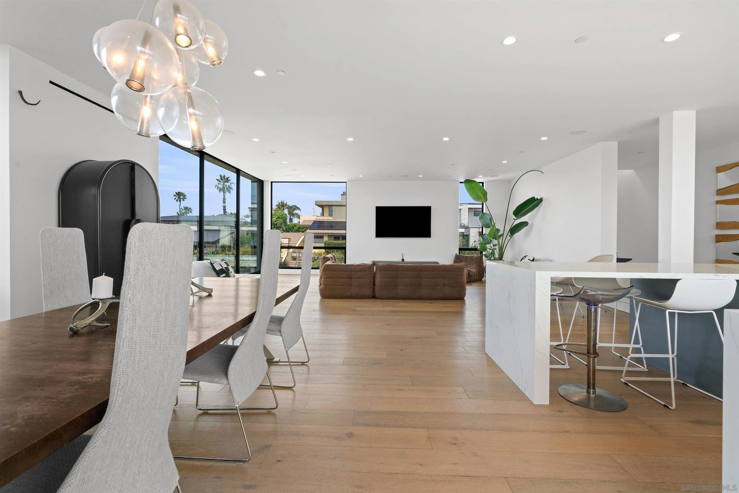 223 Ocean Street Solana Beach, CA 92075 - Photo 7 of 47 a living room with furniture a chandelier and a dining room