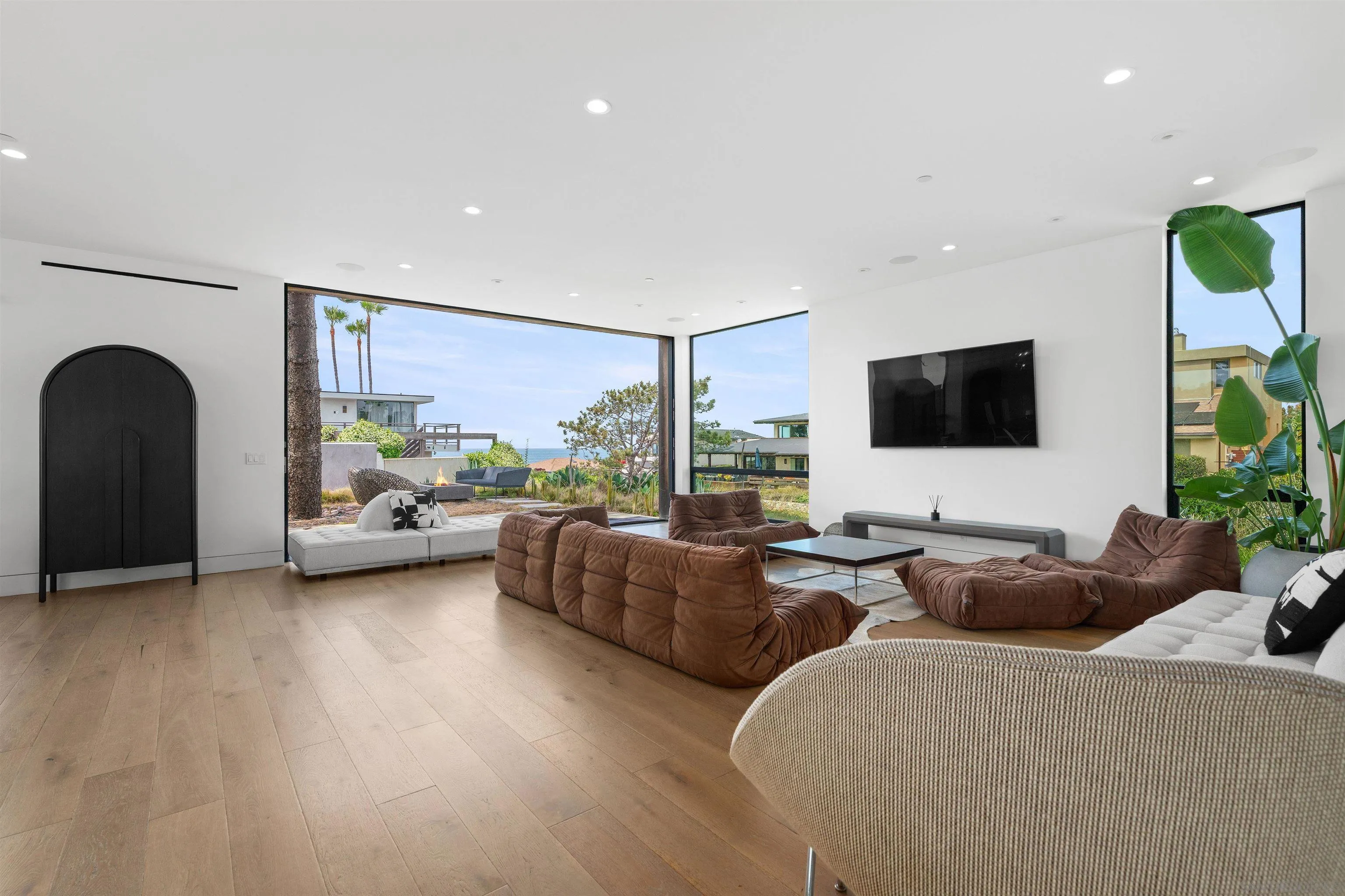223 Ocean Street Solana Beach, CA 92075 - Photo 9 of 47 a living room with furniture and a flat screen tv