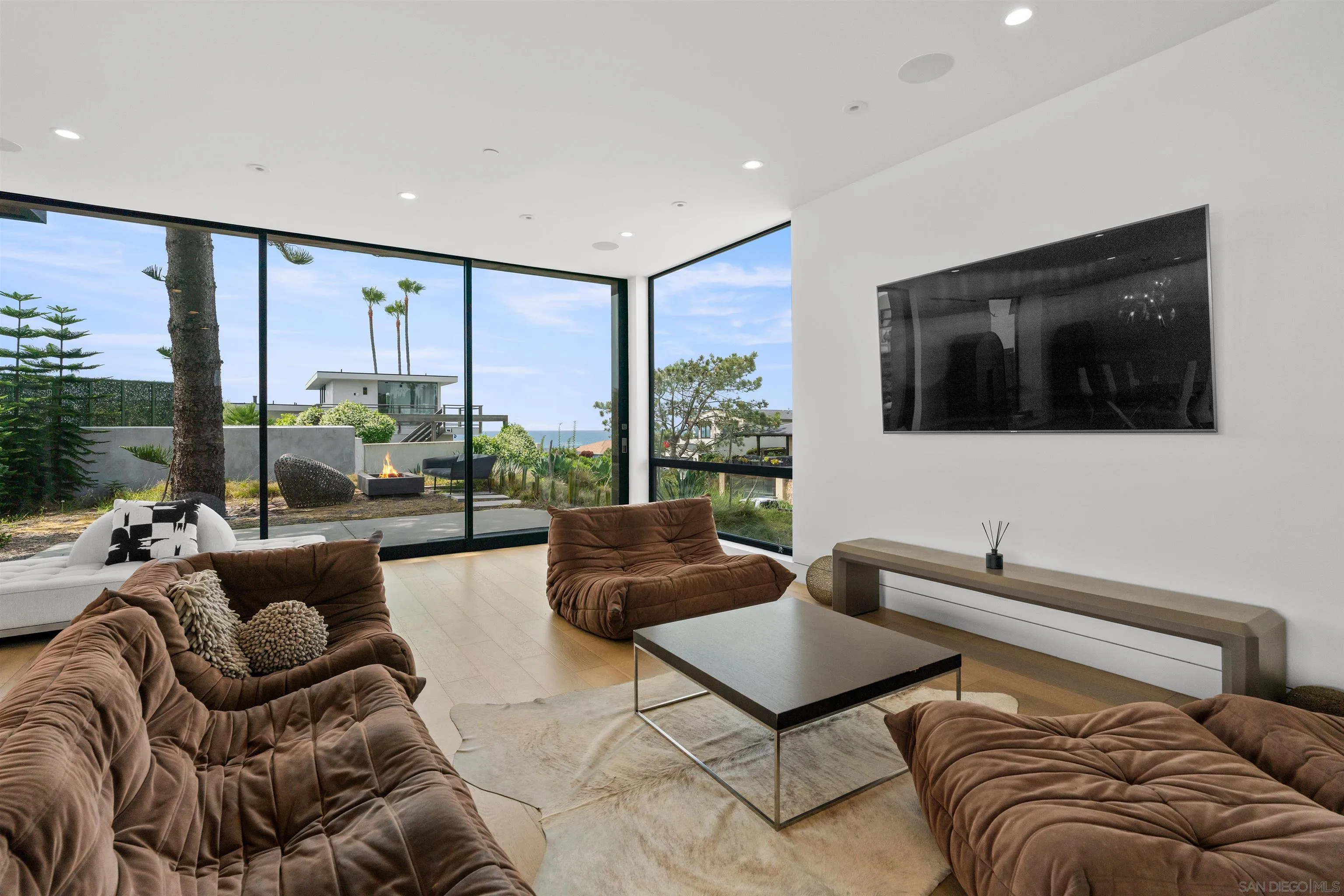 223 Ocean Street Solana Beach, CA 92075 - Photo 10 of 47 a living room with furniture and a flat screen tv