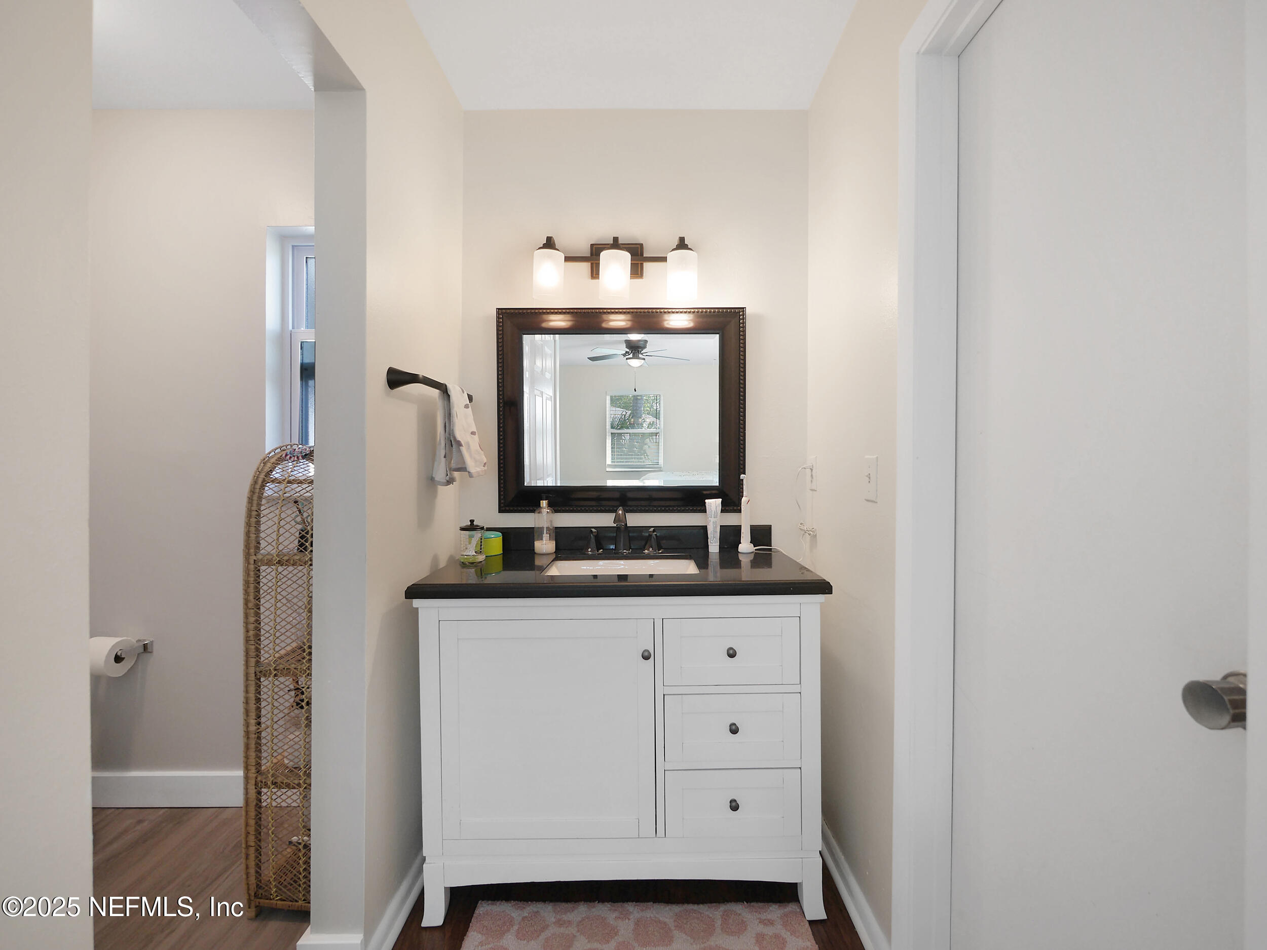 971 Viscaya Boulevard St. Augustine, FL 32086 - Photo 14 of 47 a bathroom with a sink and a mirror