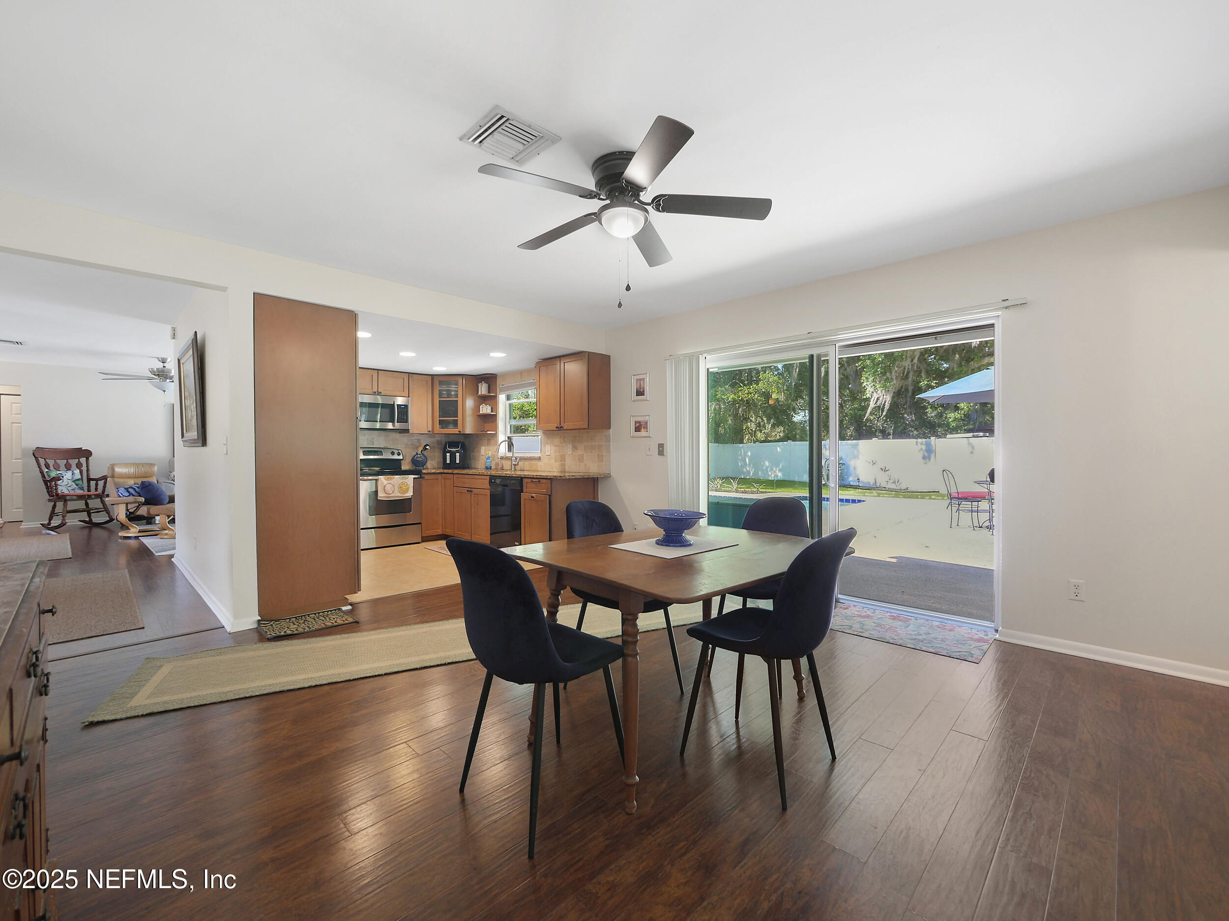 971 Viscaya Boulevard St. Augustine, FL 32086 - Photo 27 of 47 a view of a dining room with furniture window and wooden floor