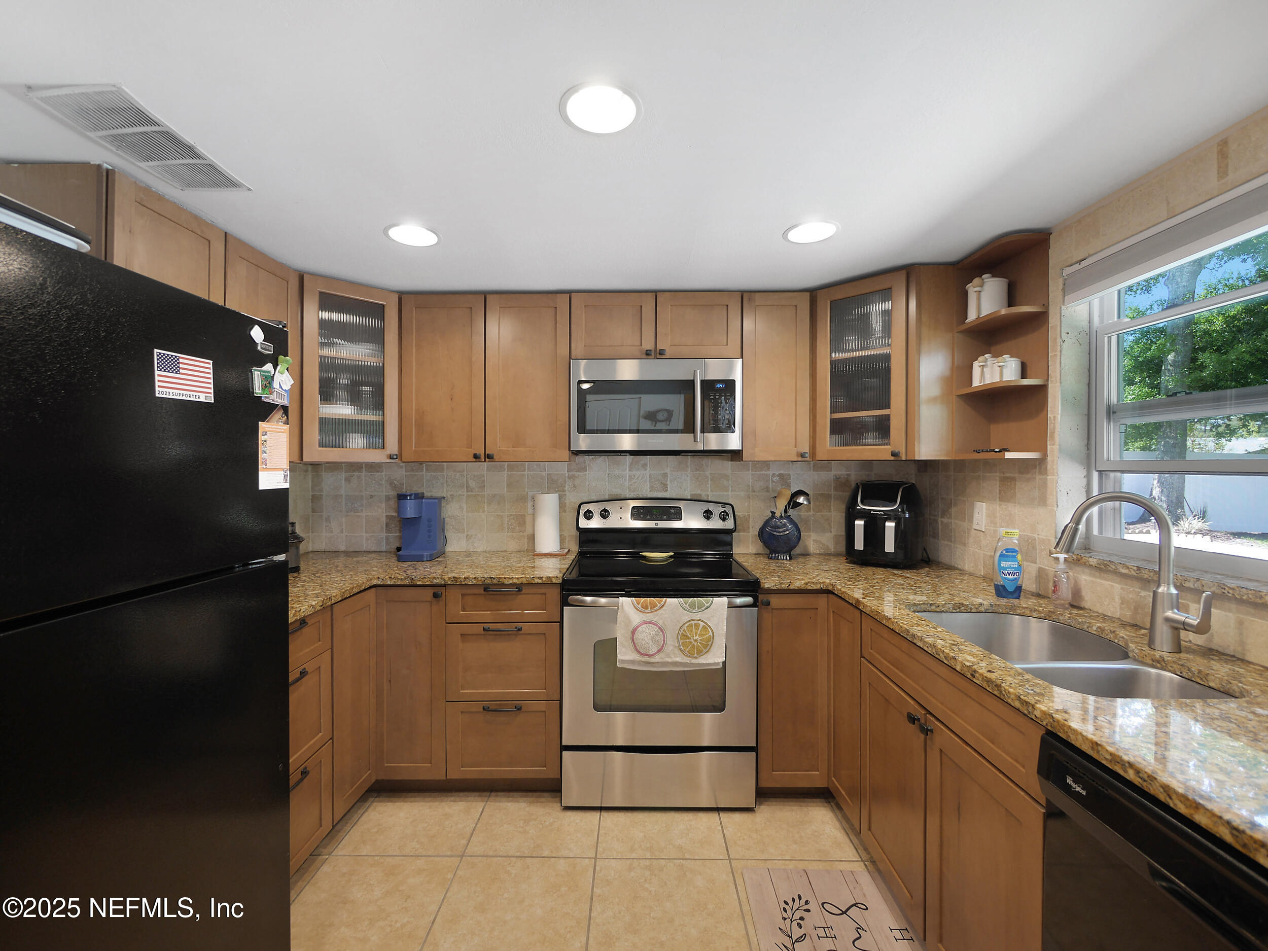 971 Viscaya Boulevard St. Augustine, FL 32086 - Photo 31 of 47 a kitchen with stainless steel appliances granite countertop a refrigerator stove top oven a sink and dishwasher