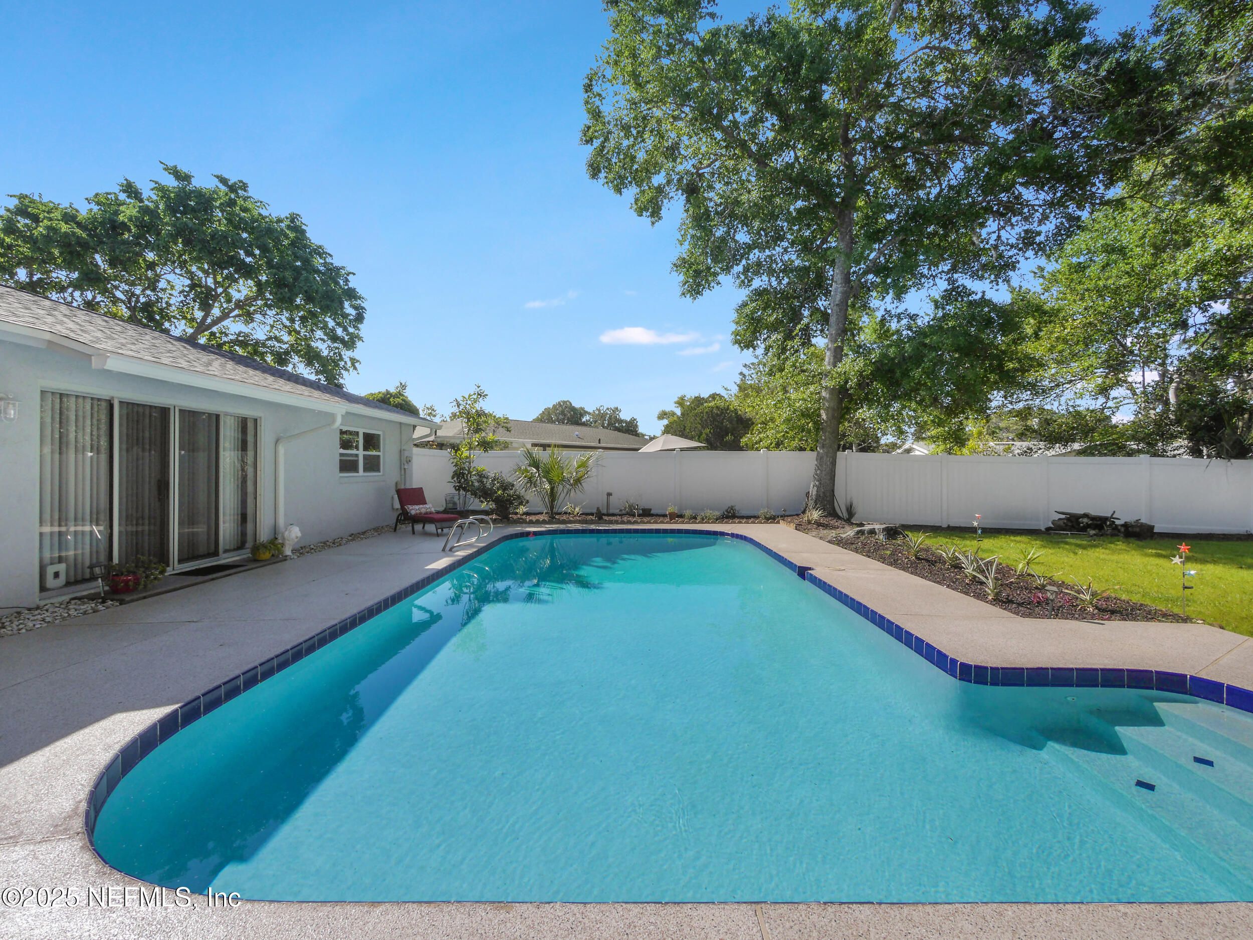 971 Viscaya Boulevard St. Augustine, FL 32086 - Photo 36 of 47 a view of a backyard with swimming pool