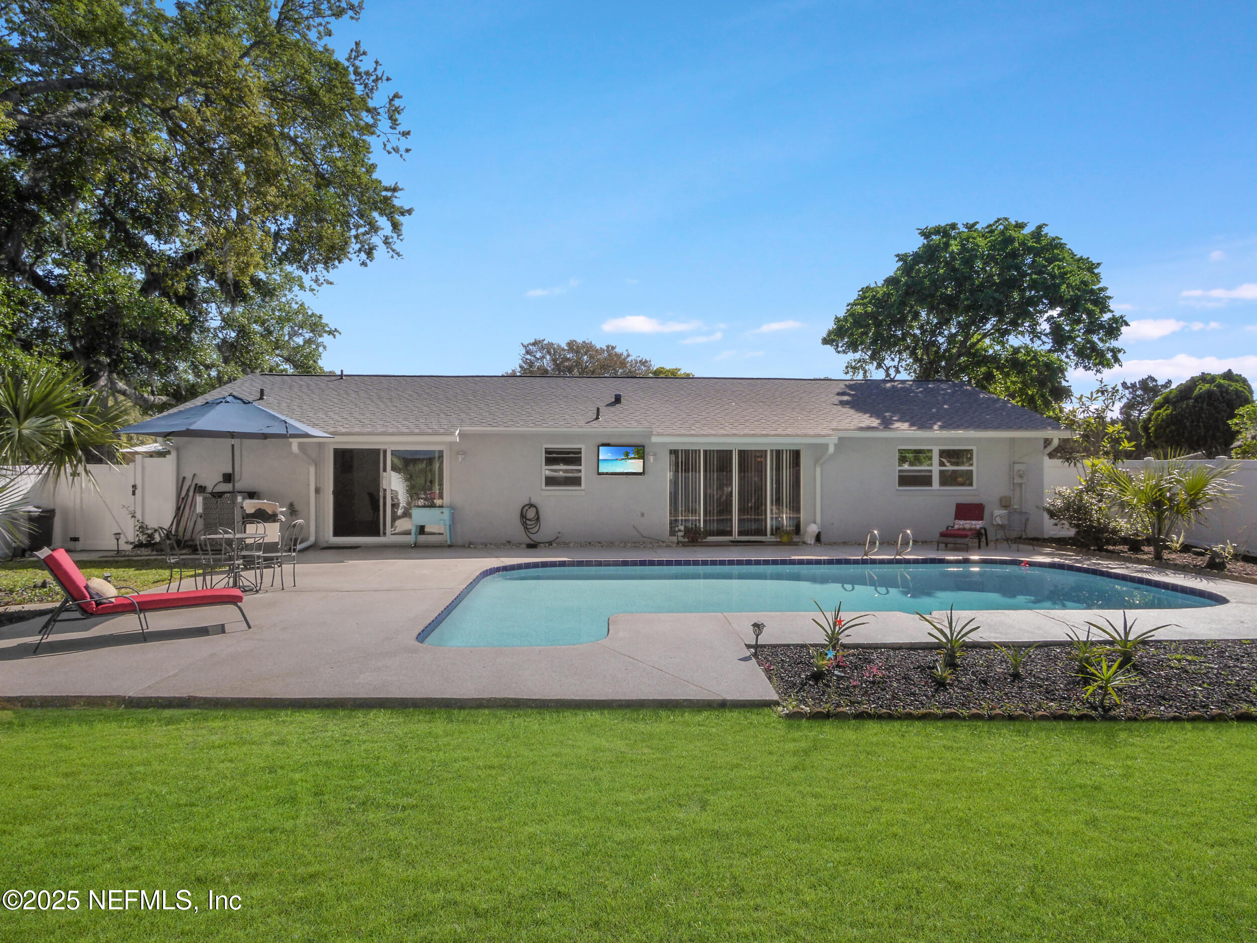 971 Viscaya Boulevard St. Augustine, FL 32086 - Photo 39 of 47 a front view of house with yard and outdoor seating