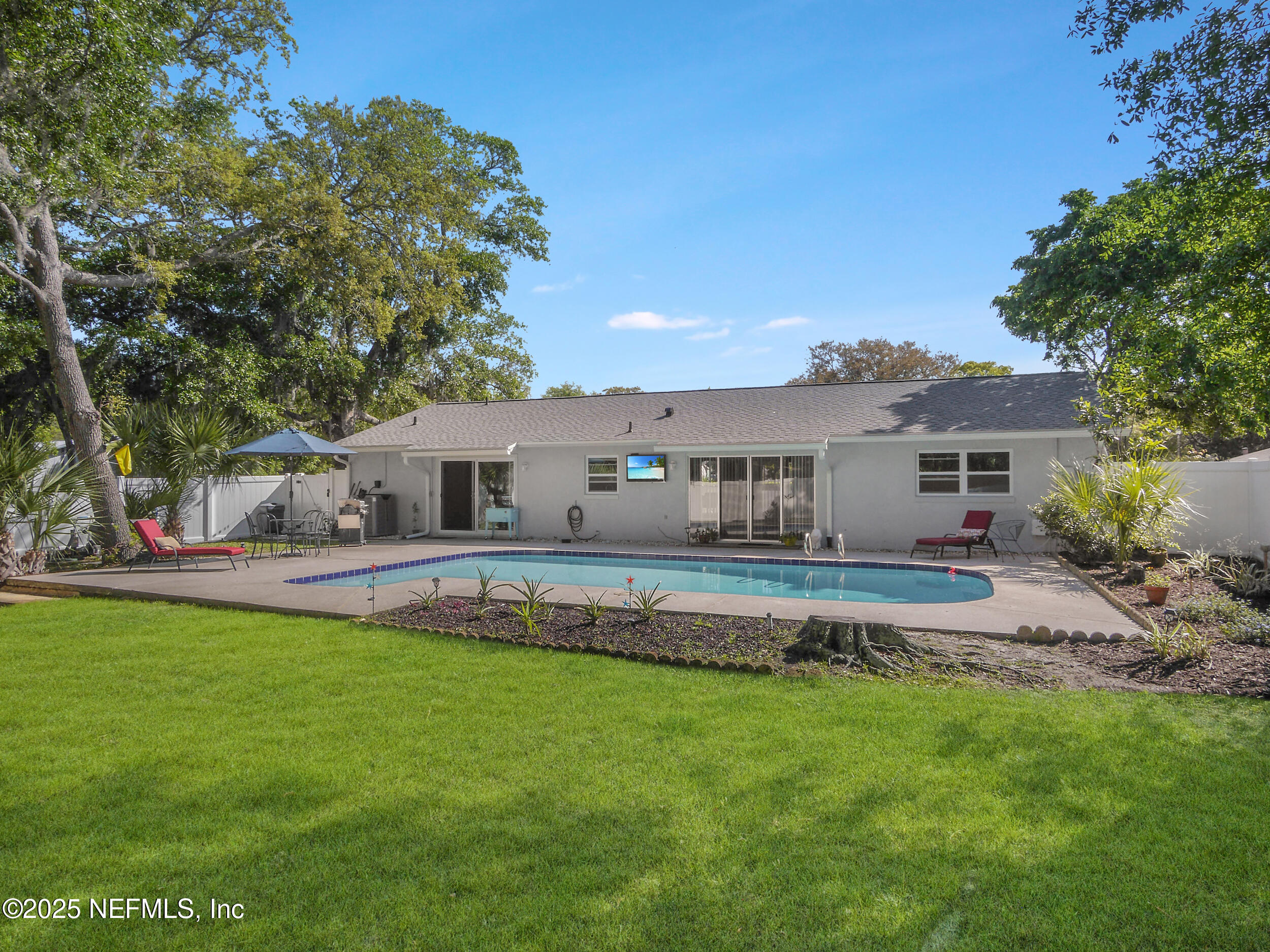 971 Viscaya Boulevard St. Augustine, FL 32086 - Photo 40 of 47 a front view of a house with a garden and plants