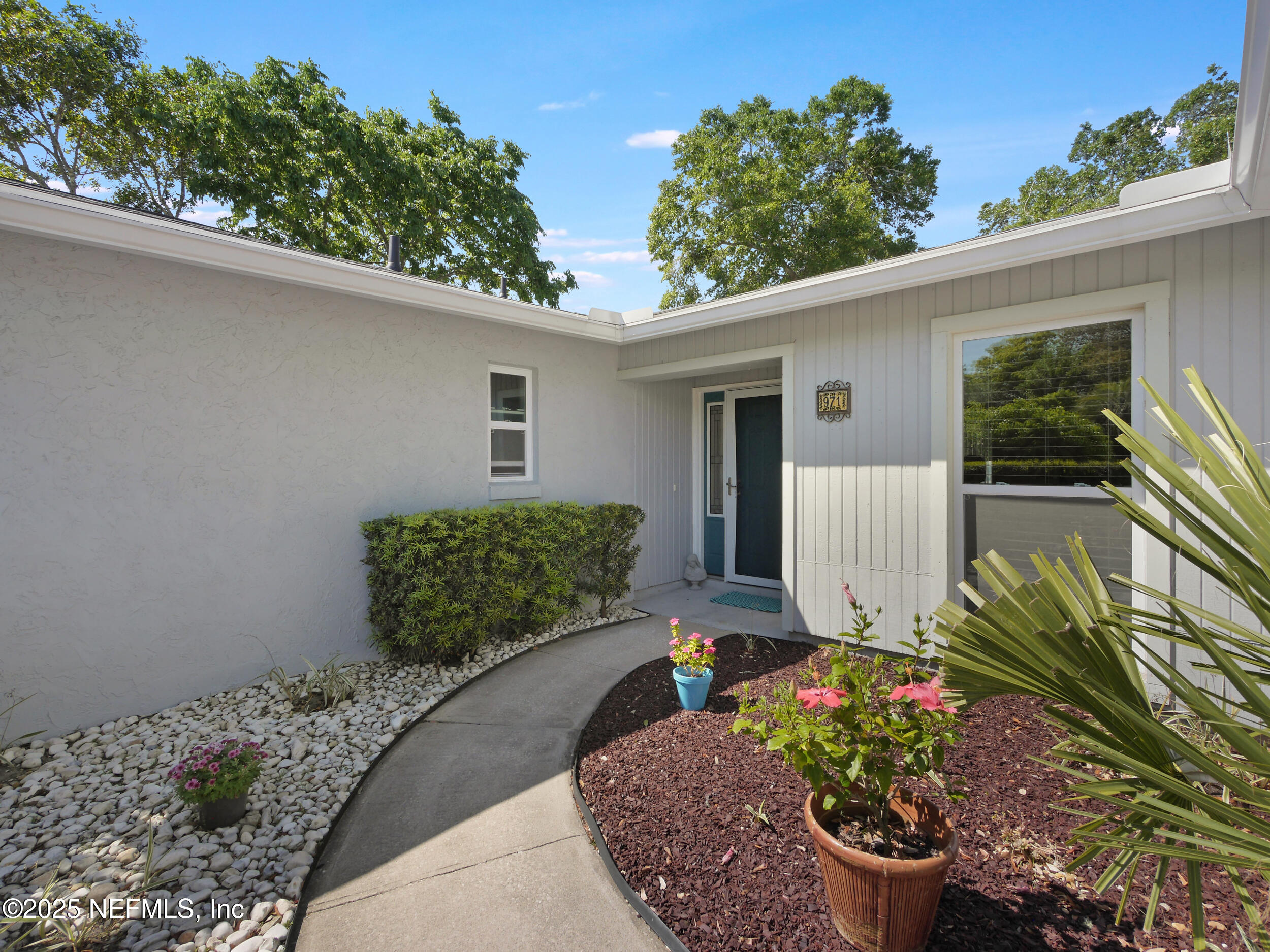 971 Viscaya Boulevard St. Augustine, FL 32086 - Photo 4 of 47 a view of a backyard with potted plants