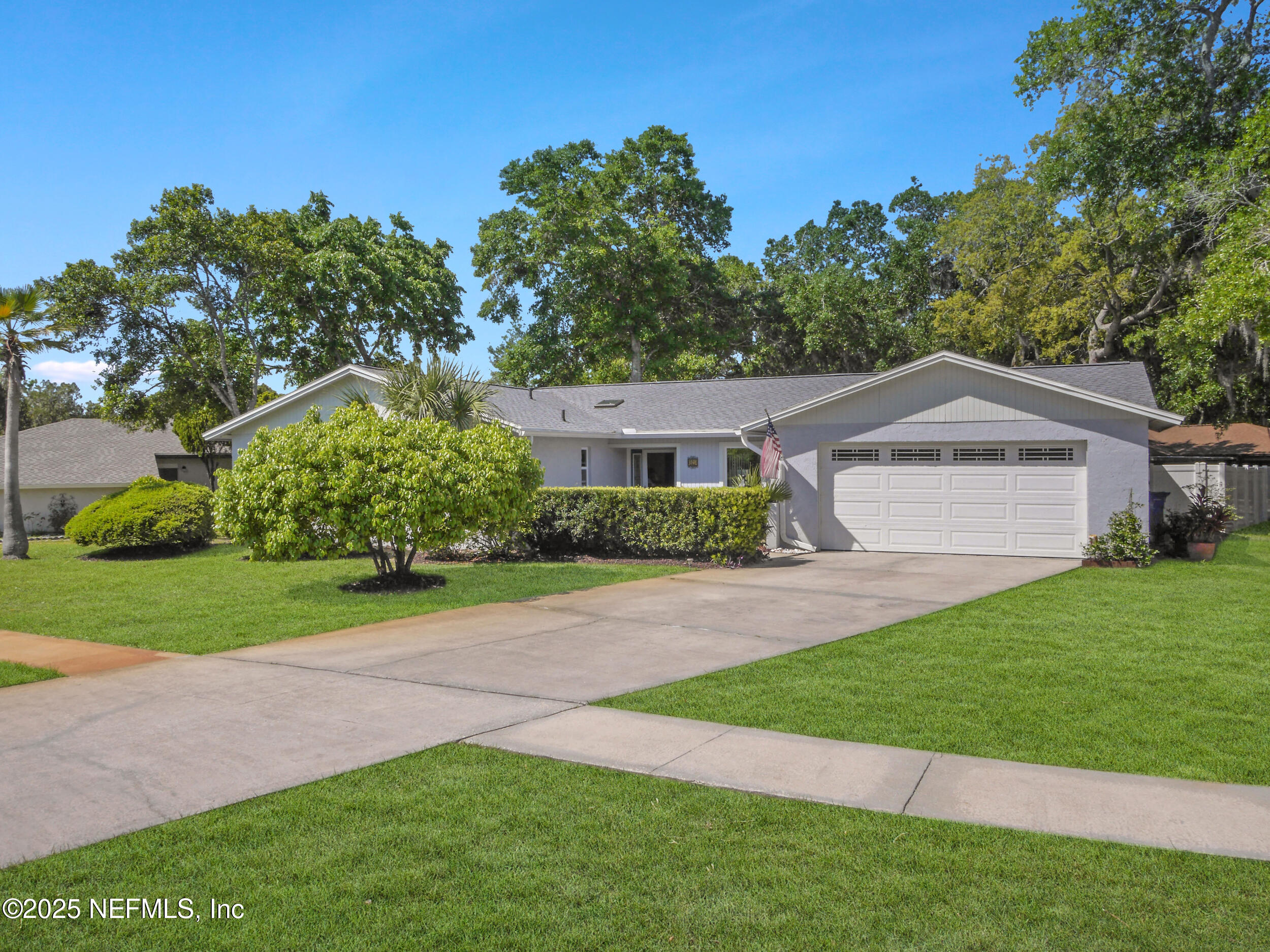 971 Viscaya Boulevard St. Augustine, FL 32086 - Photo 41 of 47 a view of a house with a yard and a large tree