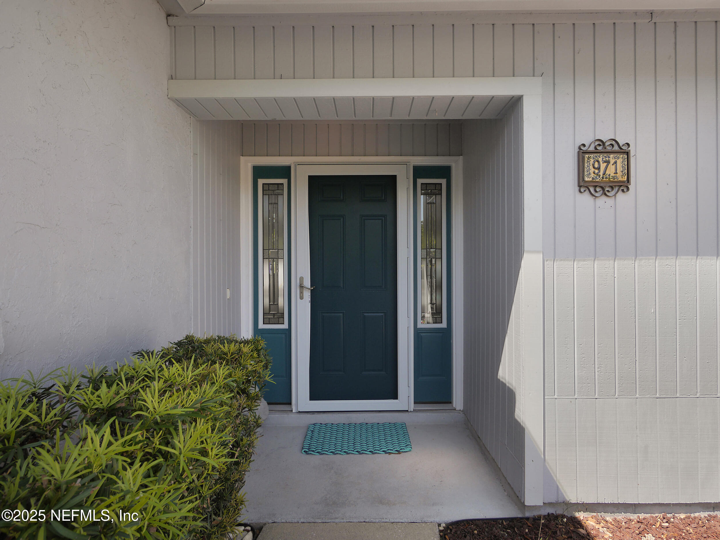 971 Viscaya Boulevard St. Augustine, FL 32086 - Photo 5 of 47 a front view of a house with a yard