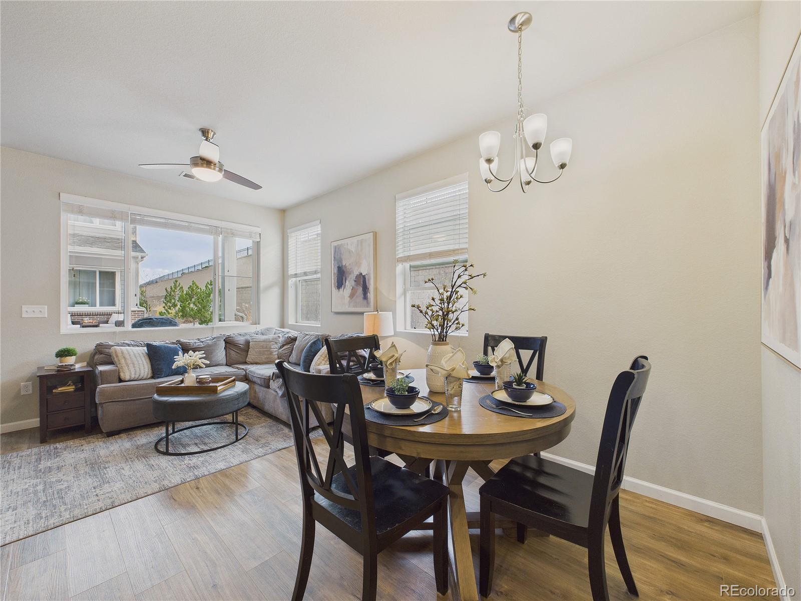 a view of a dining room with furniture window and wooden floor