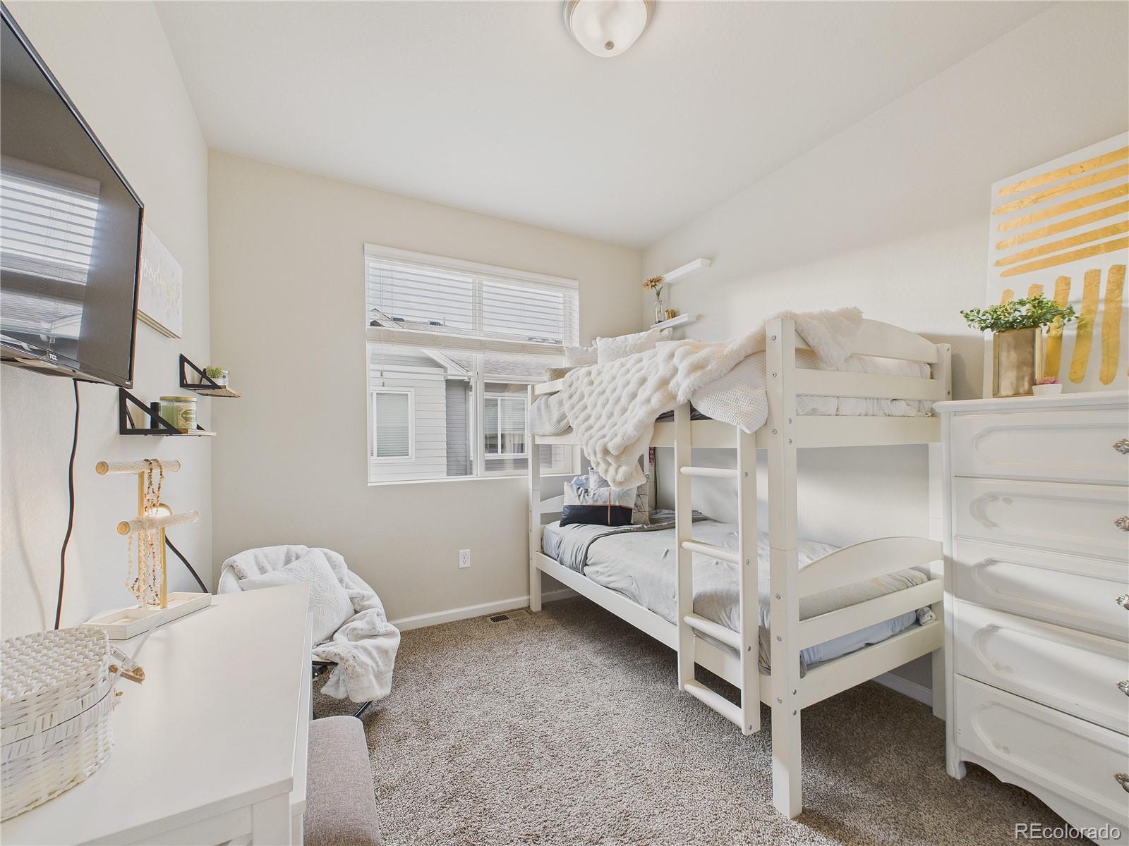 15516 West 64th Loop, Unit F Arvada, CO 80007 - Photo 9 of 23 a view of livingroom with furniture and windows
