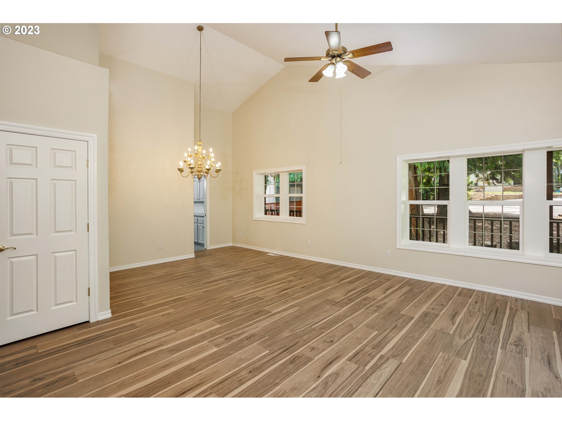 280 South 15th Court Ridgefield, WA 98642 - Photo 14 of 44 a view of an empty room with a window and wooden floor