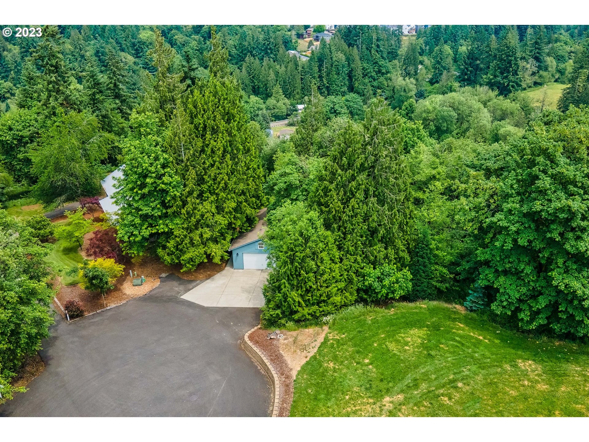 280 South 15th Court Ridgefield, WA 98642 - Photo 2 of 44 a view of a yard with a tree