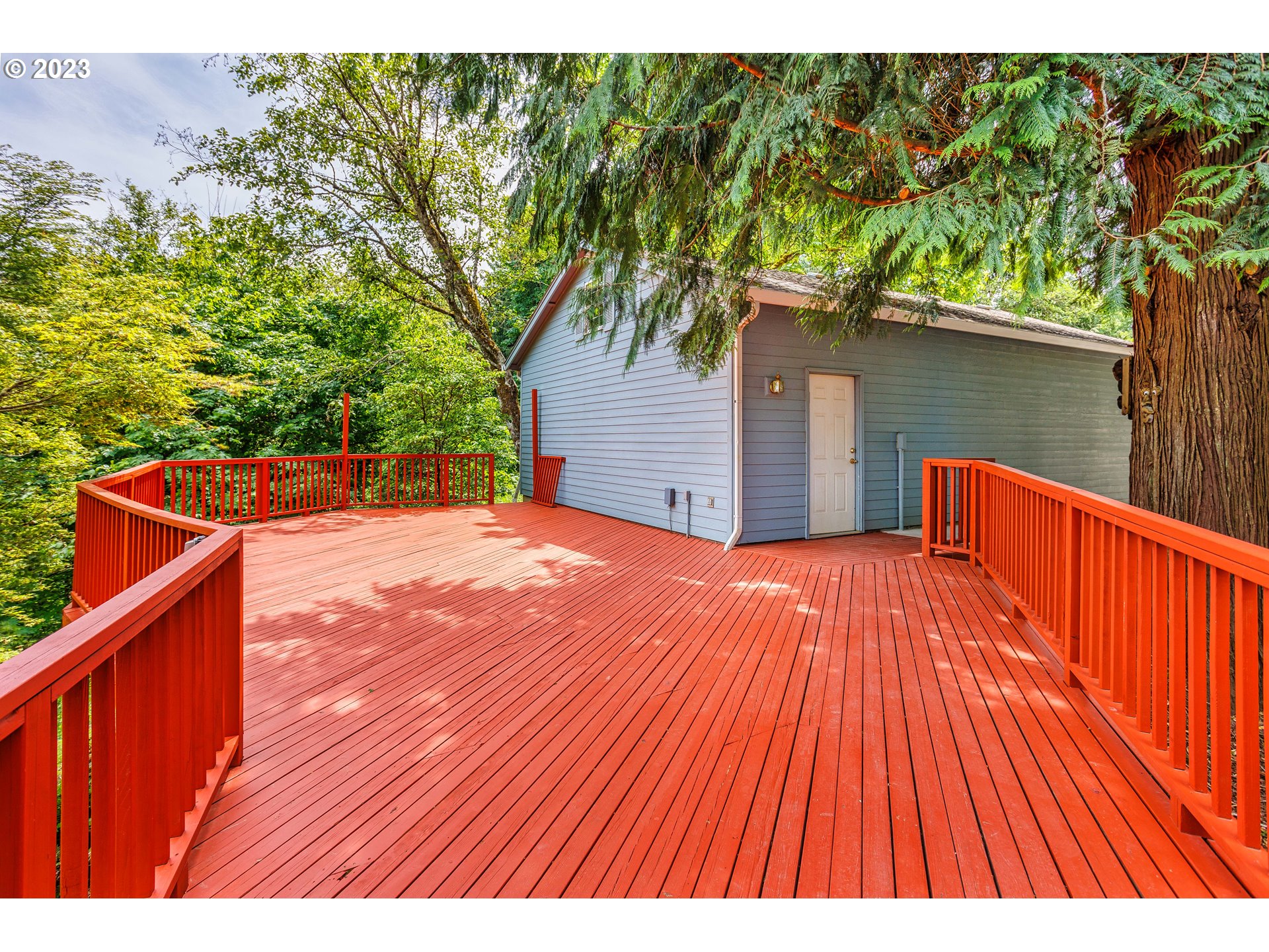 280 South 15th Court Ridgefield, WA 98642 - Photo 30 of 44 a backyard of a house with wooden floor and fence