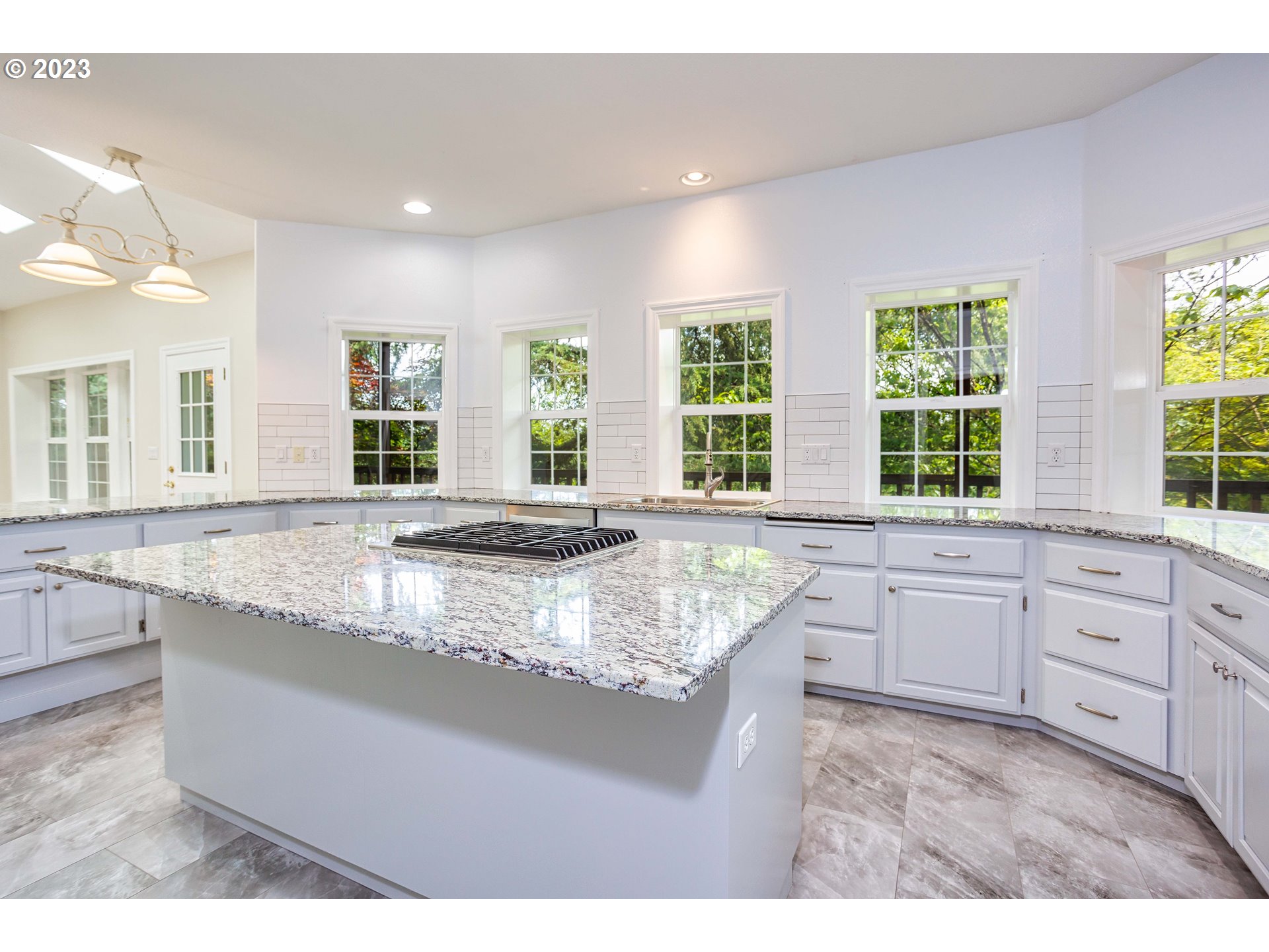 280 South 15th Court Ridgefield, WA 98642 - Photo 6 of 44 a kitchen with counter top space windows and living room