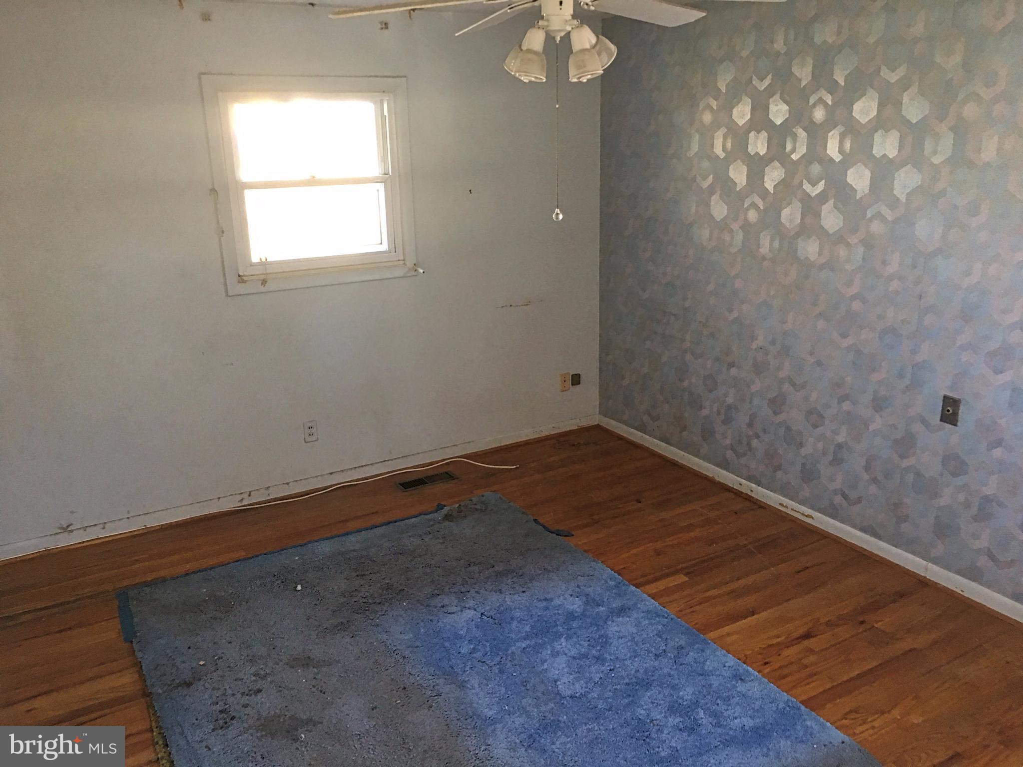 4710 Byron Road Baltimore, MD 21244 - Photo 12 of 24 a view of a room with wooden floor and fan
