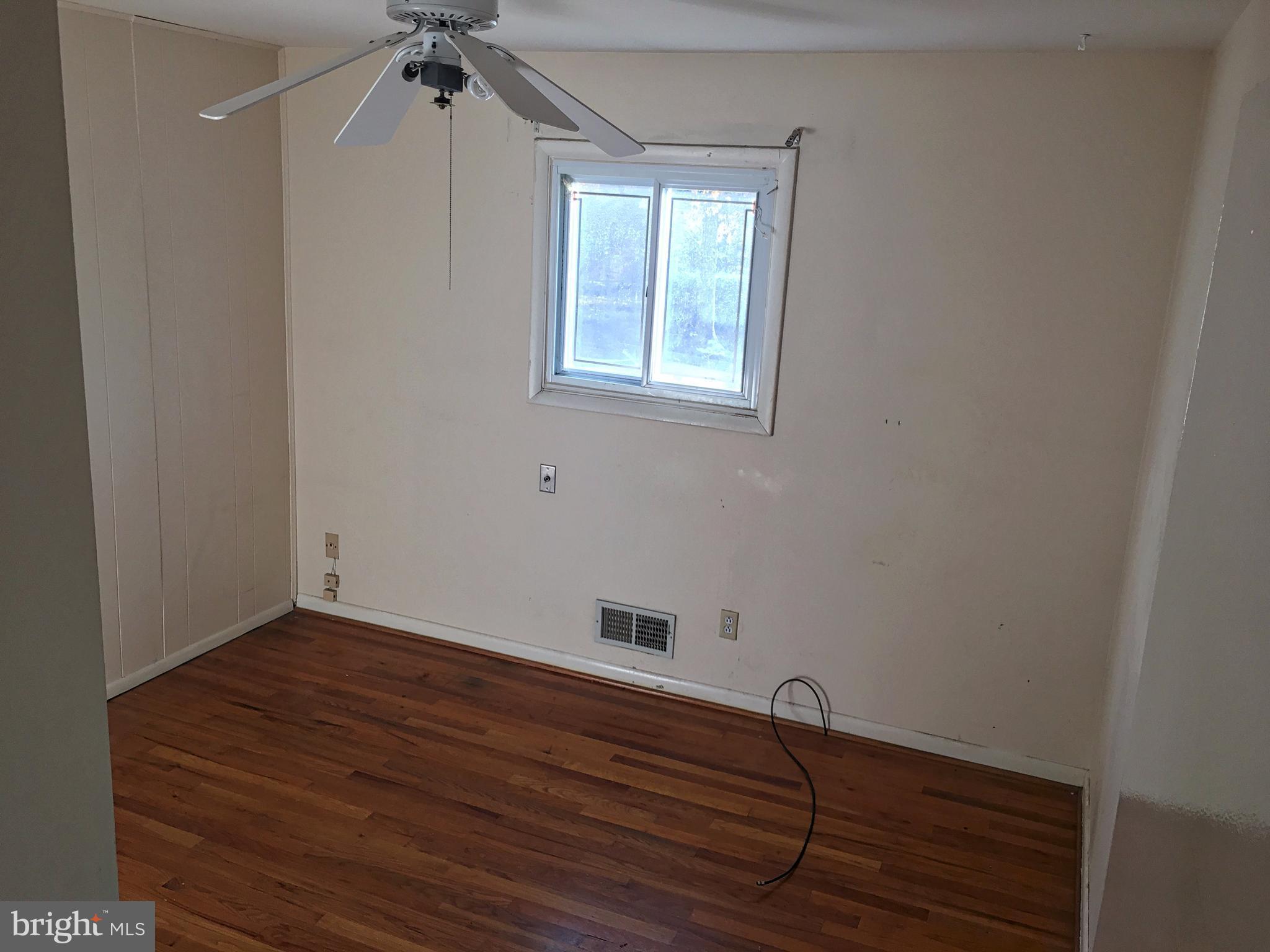 4710 Byron Road Baltimore, MD 21244 - Photo 9 of 24 a room with window and hardwood floor