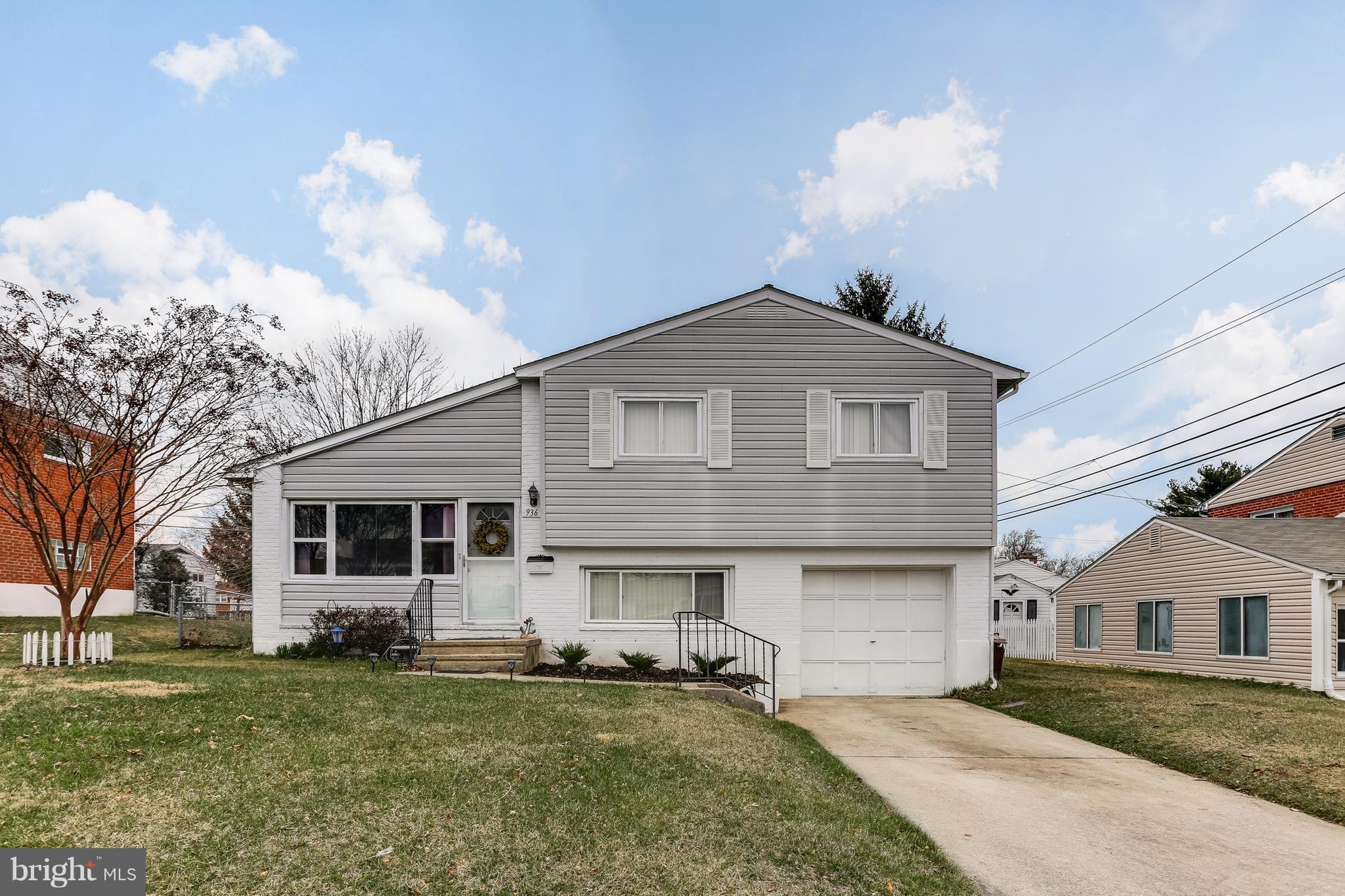 936 Vanderwood Road Baltimore, MD 21228 - Photo 1 of 27 a front view of a house with a yard