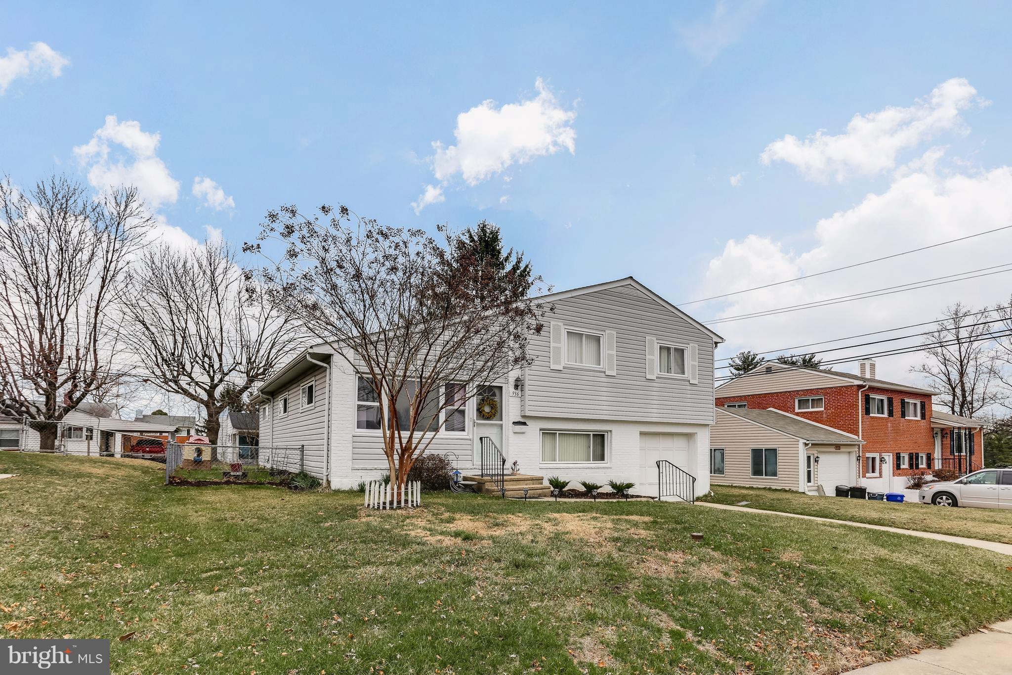 936 Vanderwood Road Baltimore, MD 21228 - Photo 3 of 27 a front view of a house with a yard