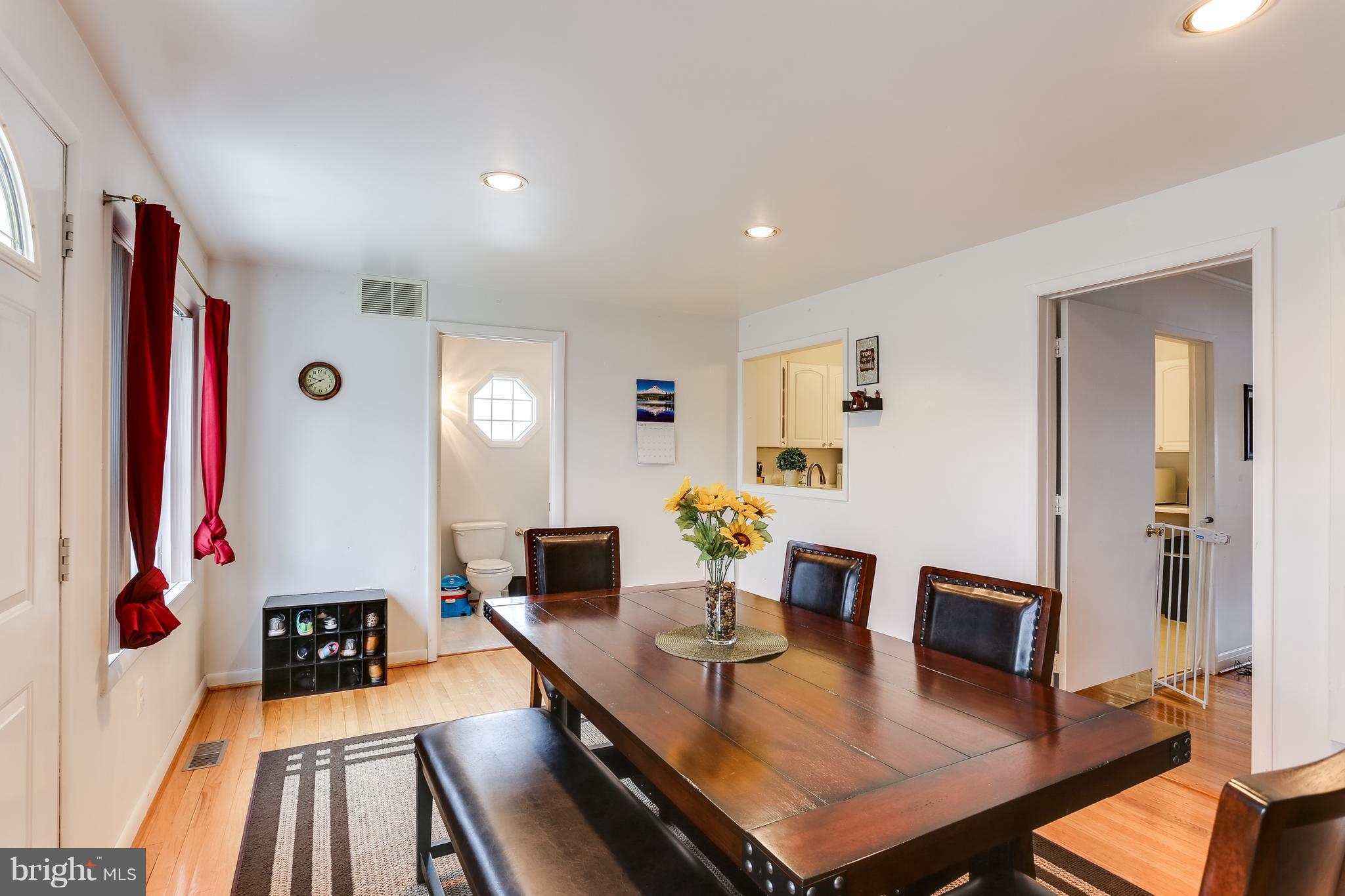 936 Vanderwood Road Baltimore, MD 21228 - Photo 10 of 27 a living room with furniture and a flat screen tv