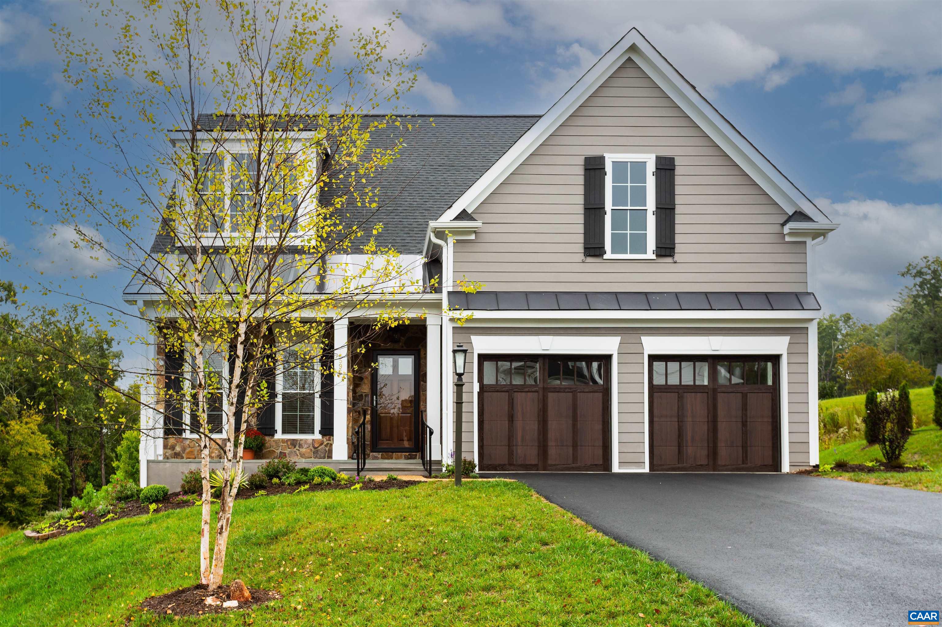 596 Drumin Road Keswick, VA 22947 - Photo 1 of 57 a view of a house with a yard and plants