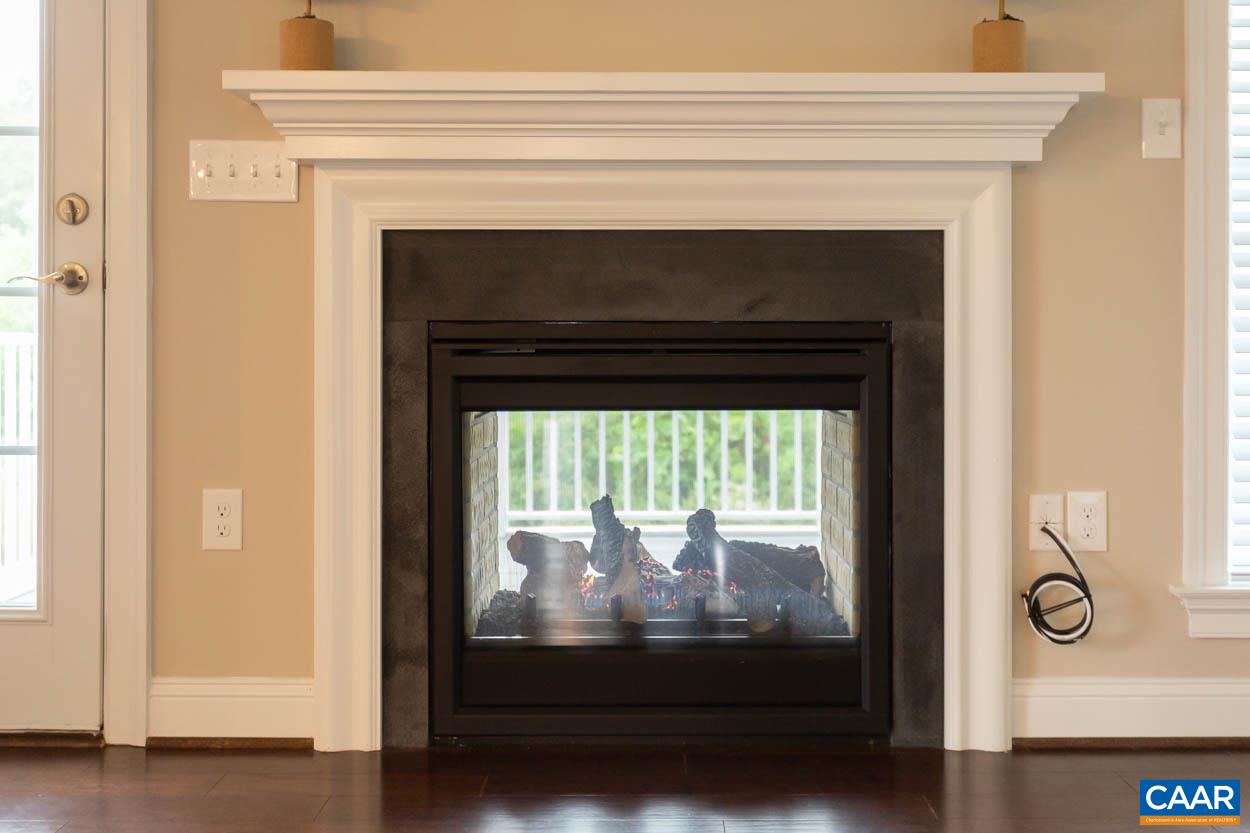 596 Drumin Road Keswick, VA 22947 - Photo 17 of 57 a view of a livingroom with a fireplace