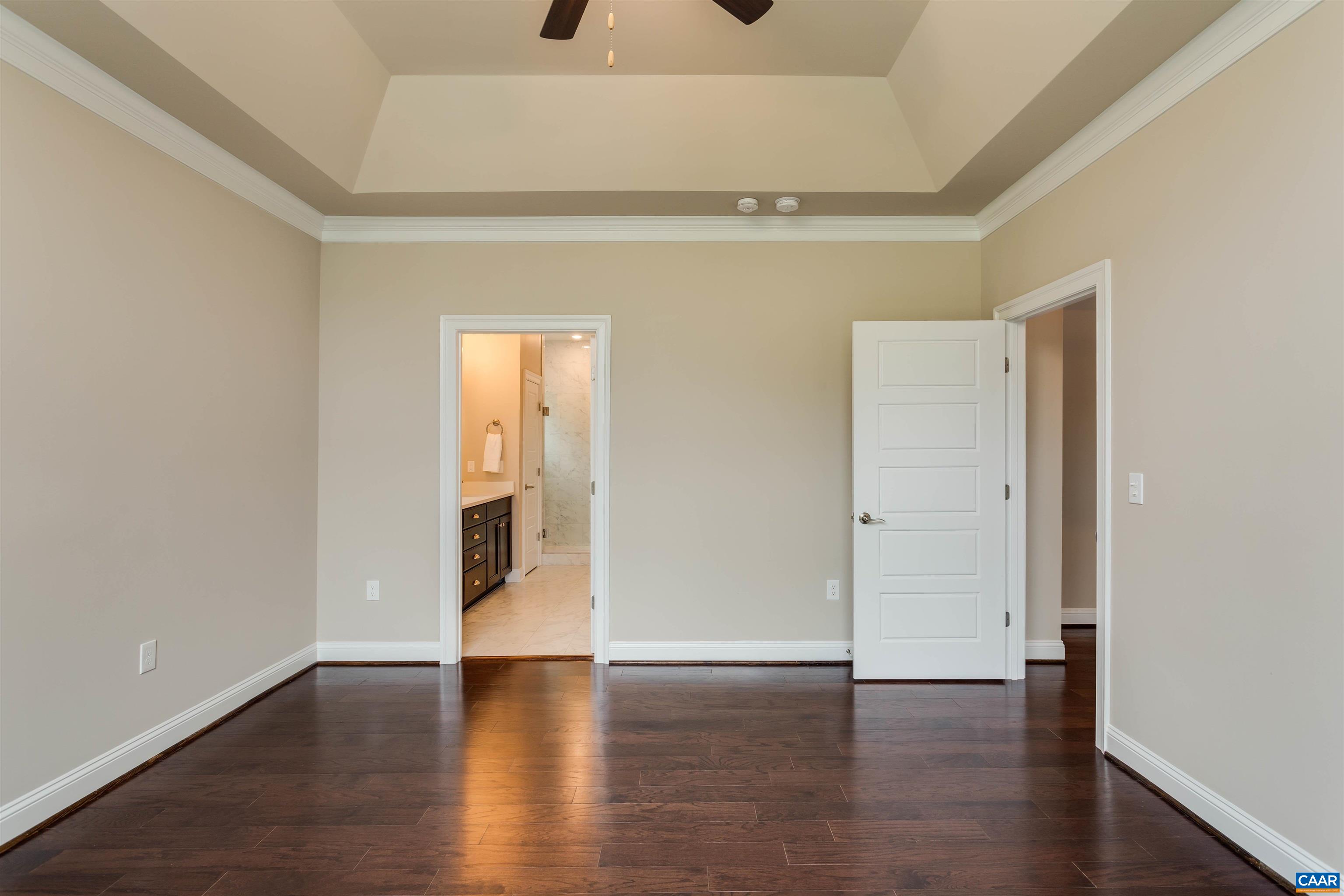 596 Drumin Road Keswick, VA 22947 - Photo 24 of 57 a view of an empty room with wooden floor and closet