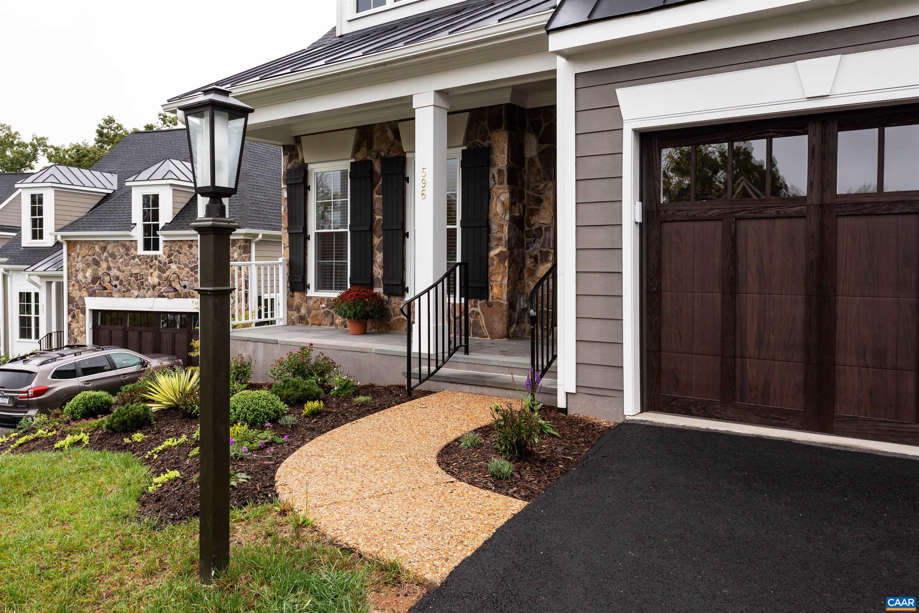 596 Drumin Road Keswick, VA 22947 - Photo 3 of 57 a front view of a house with garden