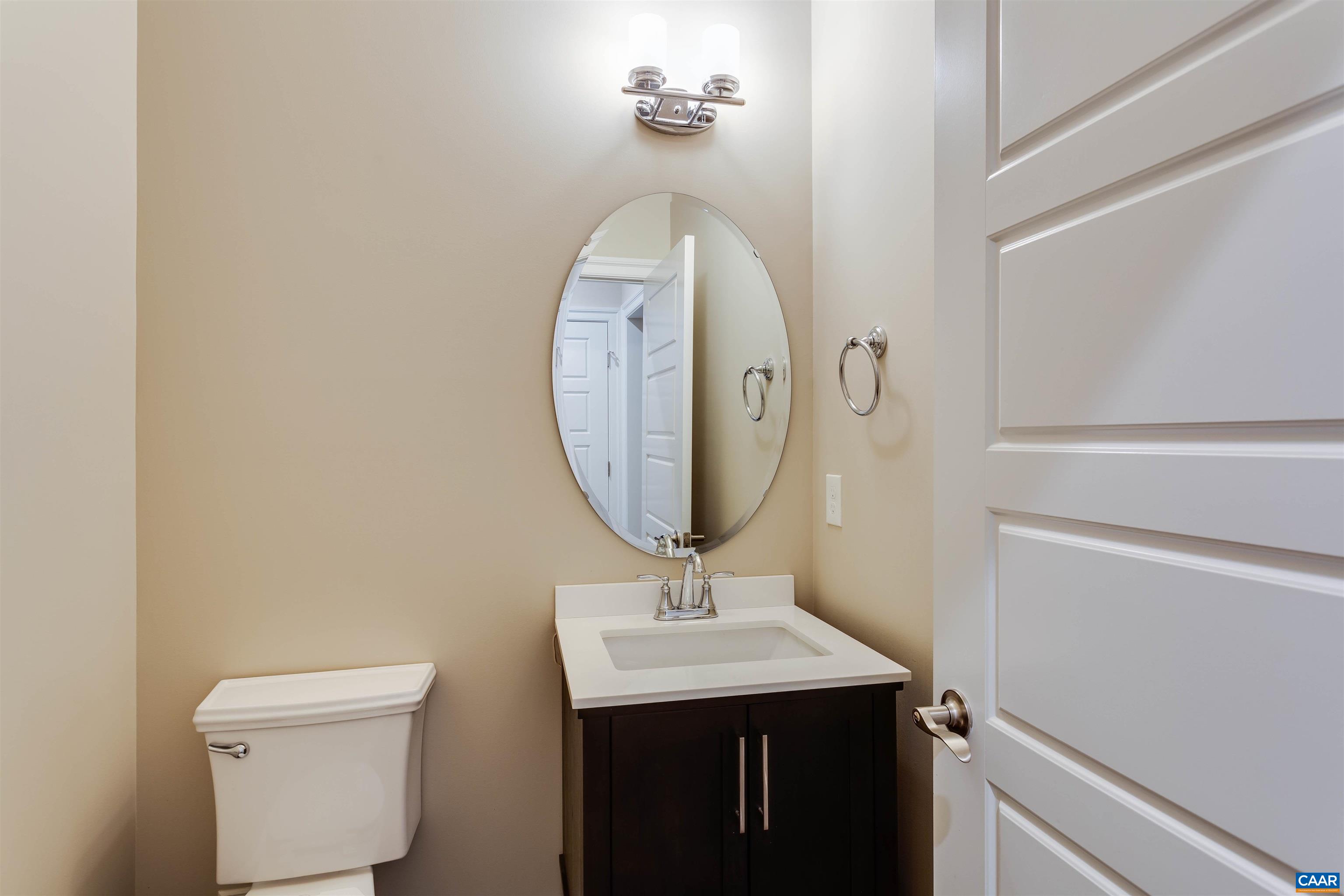 596 Drumin Road Keswick, VA 22947 - Photo 35 of 57 a bathroom with a sink a mirror and toilet