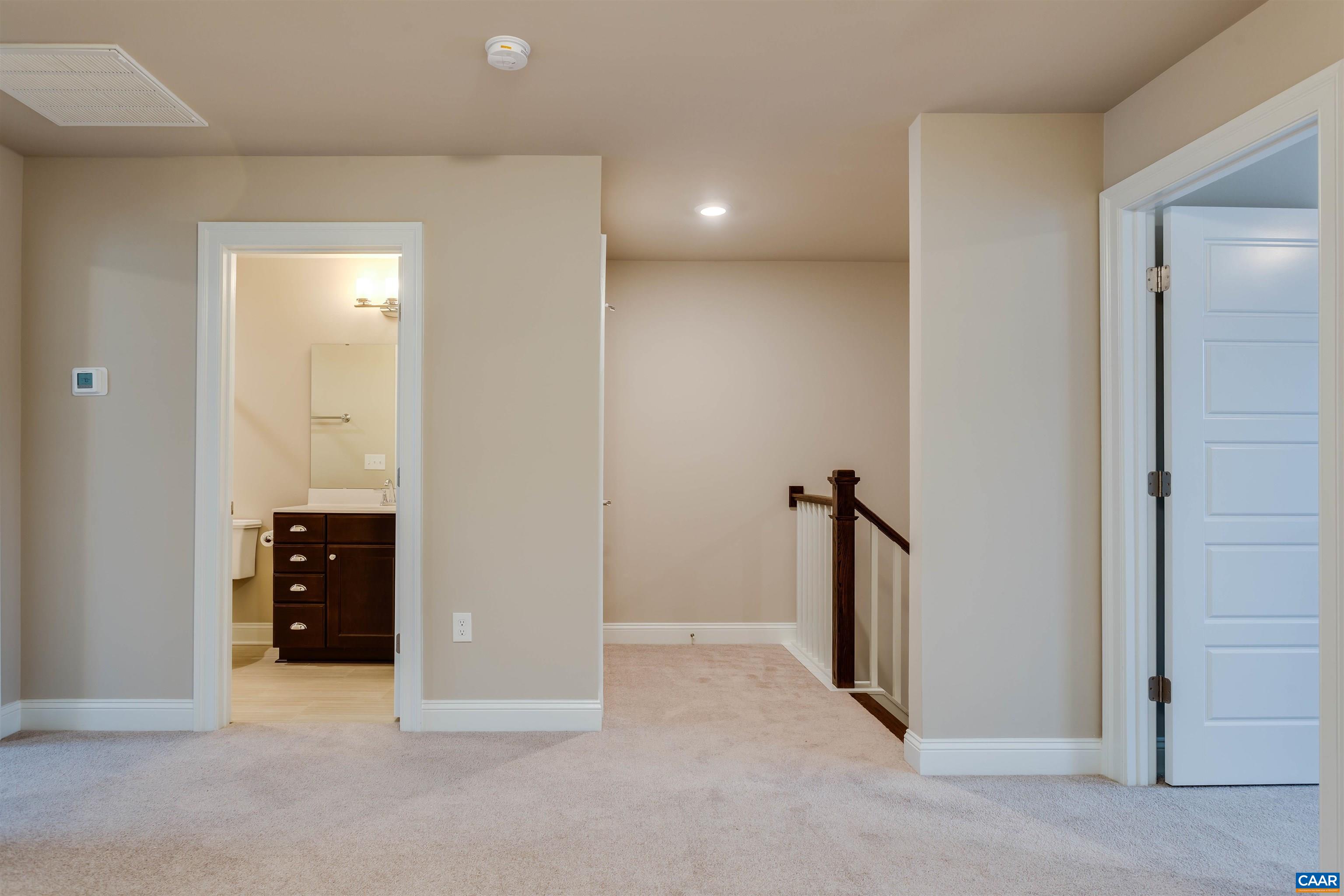 596 Drumin Road Keswick, VA 22947 - Photo 37 of 57 an empty room with closet and a bathroom