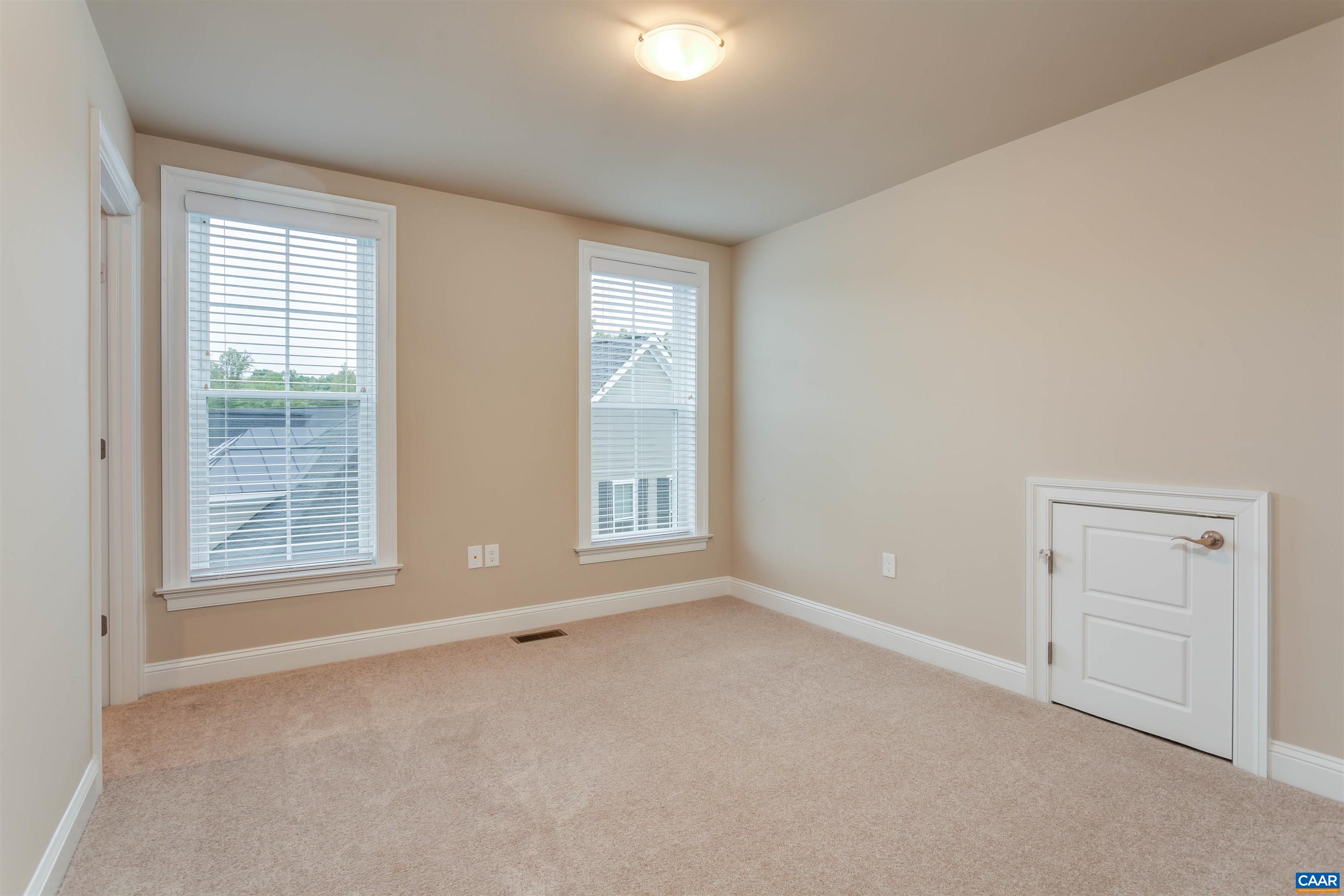 596 Drumin Road Keswick, VA 22947 - Photo 39 of 57 an empty room with windows