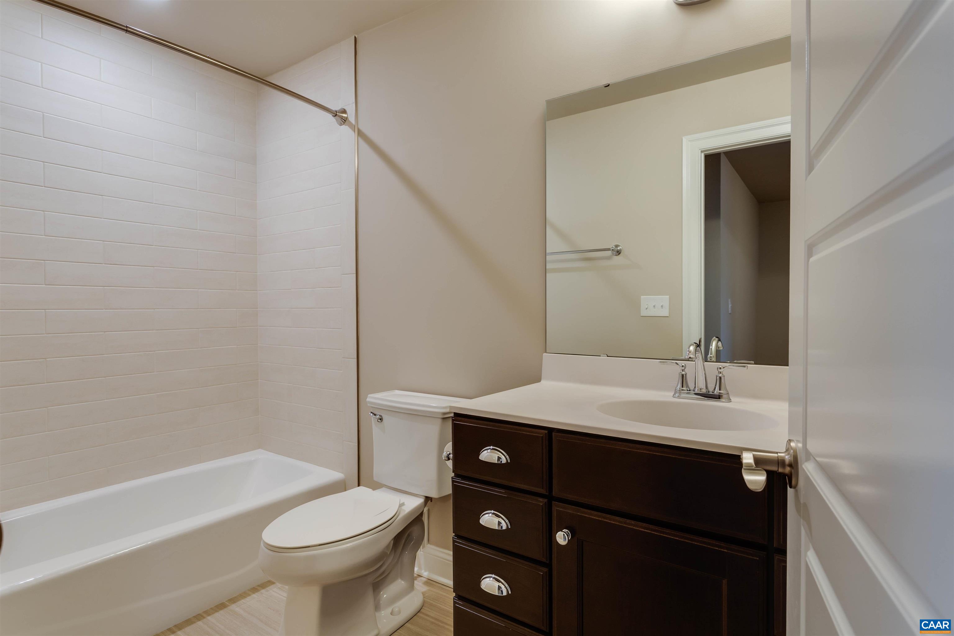 596 Drumin Road Keswick, VA 22947 - Photo 40 of 57 a bathroom with a sink a toilet and shower