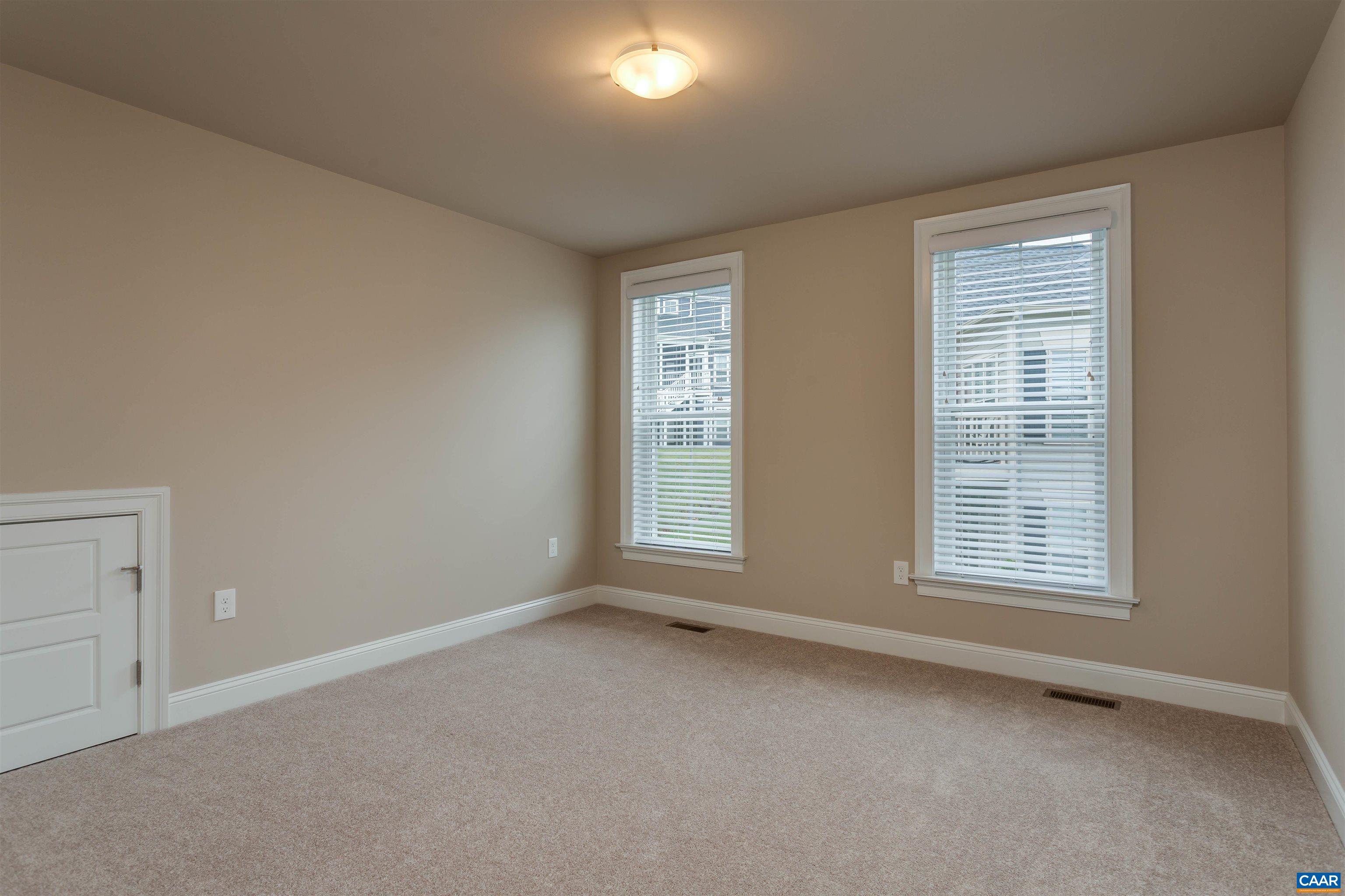596 Drumin Road Keswick, VA 22947 - Photo 41 of 57 a view of an empty room with a window