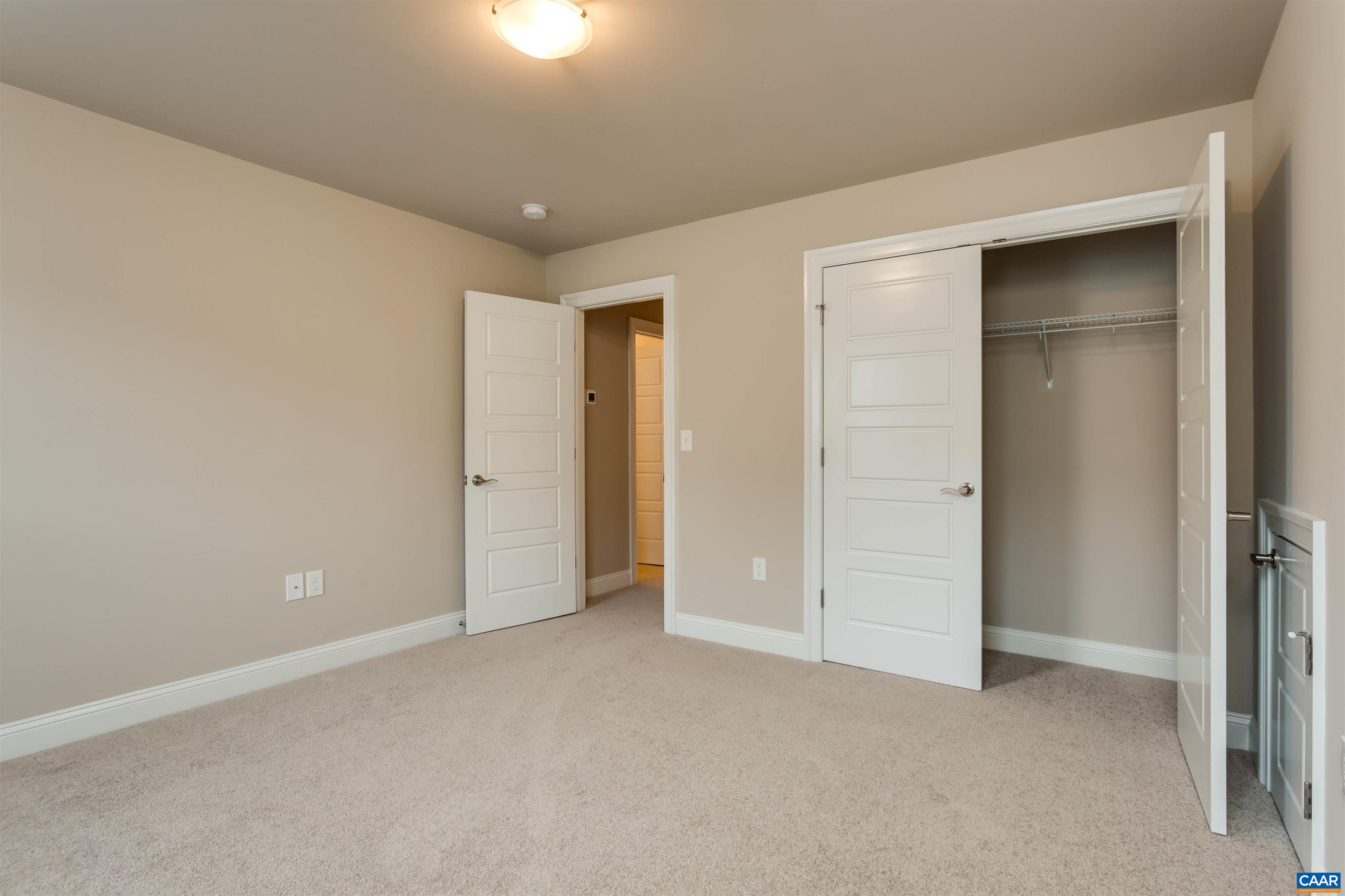 596 Drumin Road Keswick, VA 22947 - Photo 42 of 57 an empty room with closet area