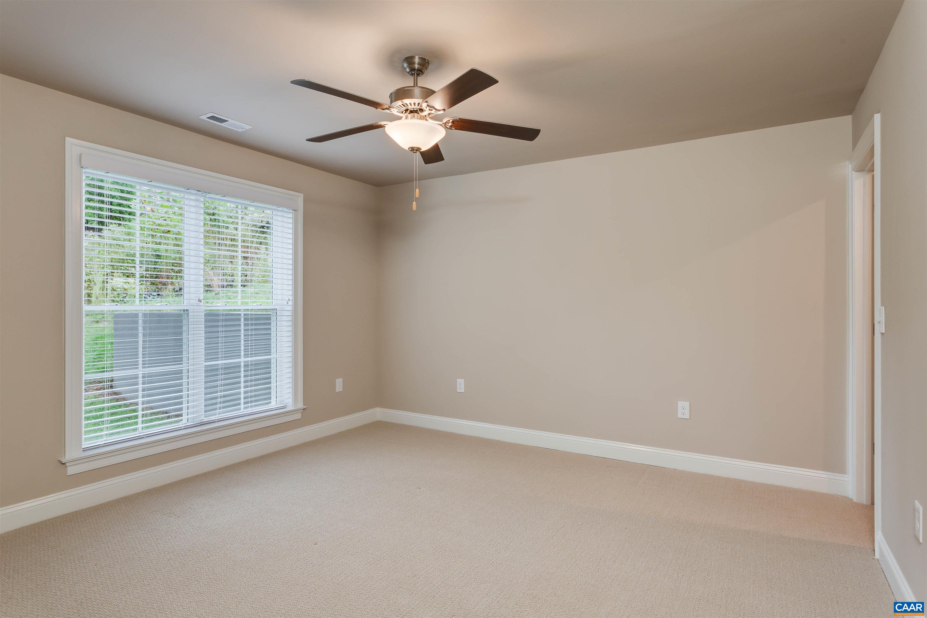 596 Drumin Road Keswick, VA 22947 - Photo 46 of 57 a view of an empty room with a window
