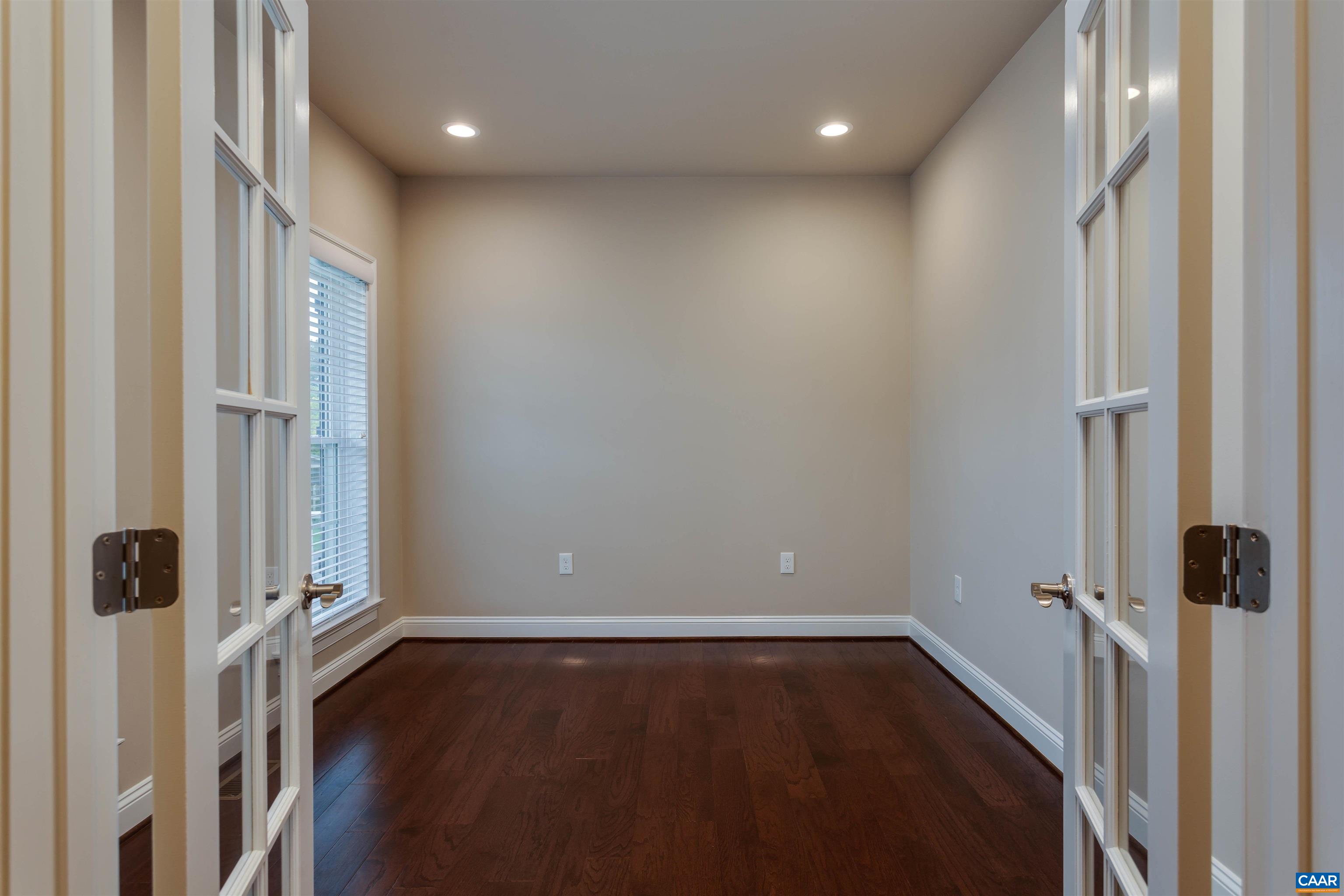 596 Drumin Road Keswick, VA 22947 - Photo 6 of 57 an empty room with wooden floor and a window