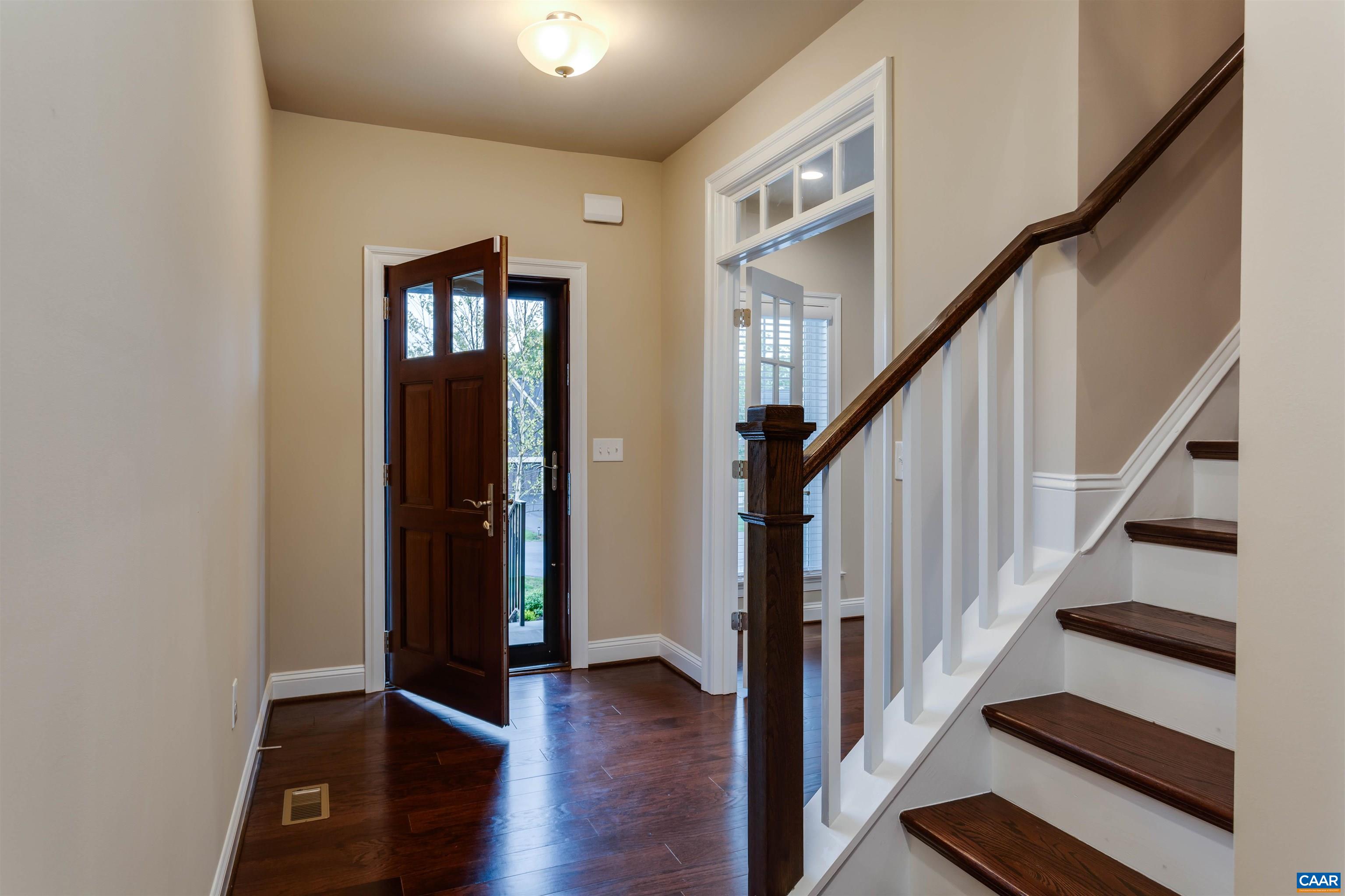 596 Drumin Road Keswick, VA 22947 - Photo 8 of 57 an entryway with wooden floor and stairs