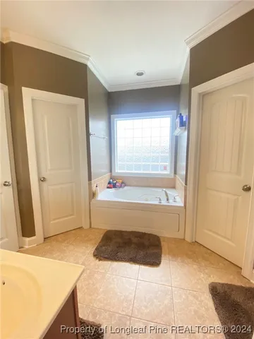 a large bathroom with a sink and a mirror